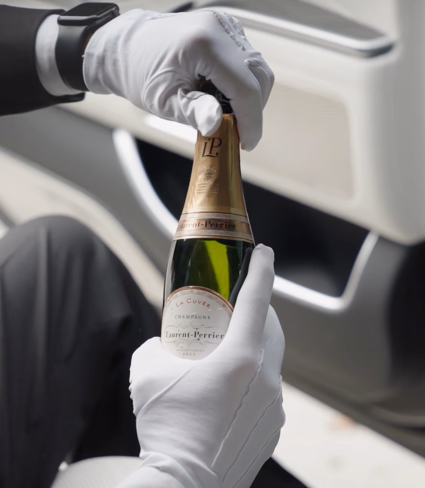 Champagne service inside the Mercedes Maybach S-Class for exclusive VIP transfers