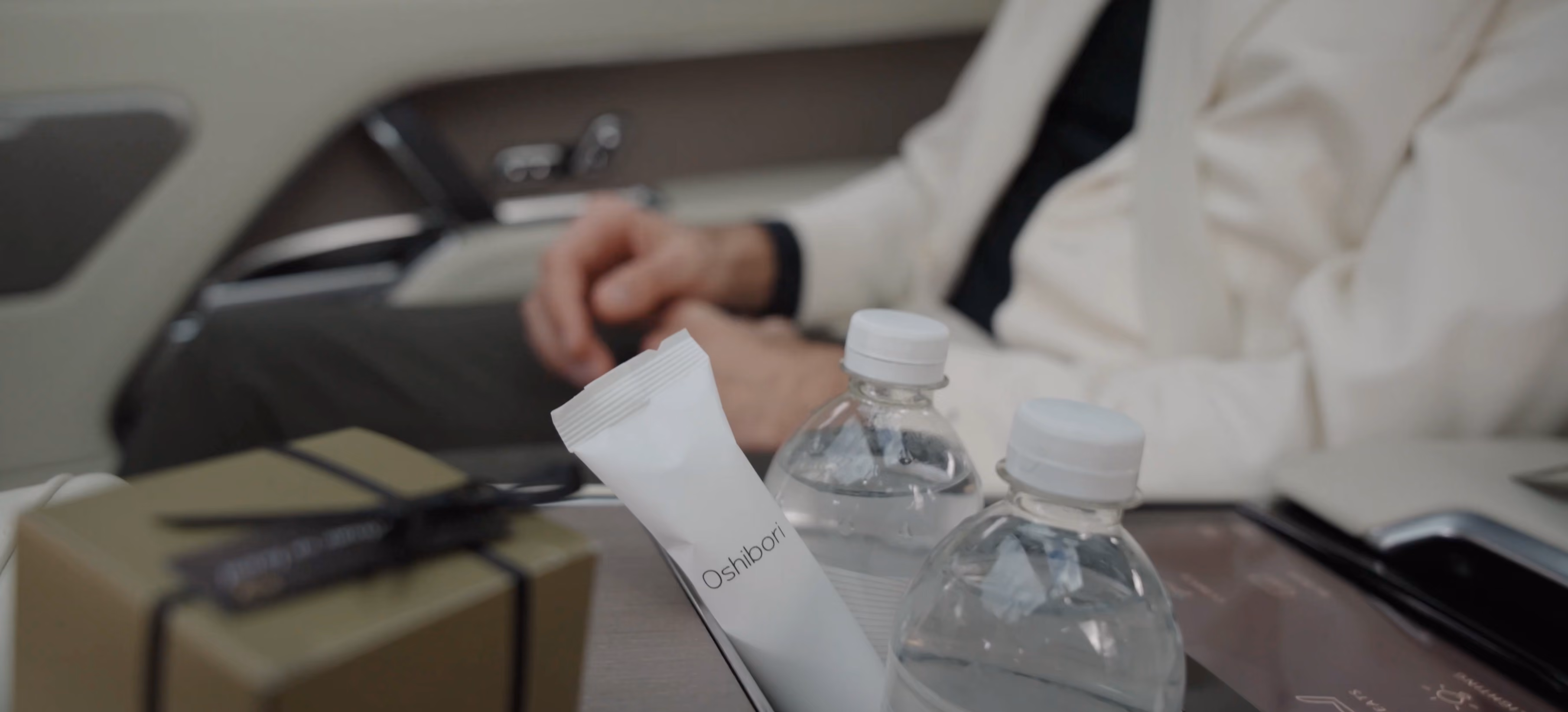 Onboard service detail inside the Range Rover Autobiography with bottled water and travel essentials