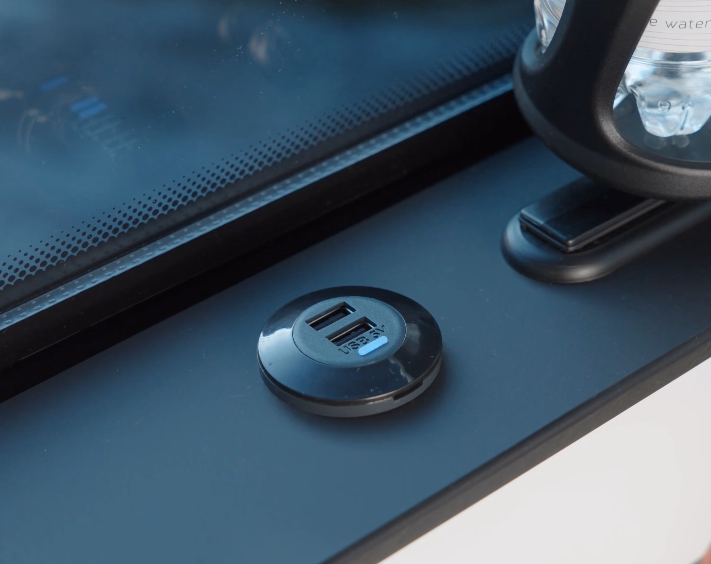 USB charging detail inside the Moveolux Limovan Portofino for connected executive travel