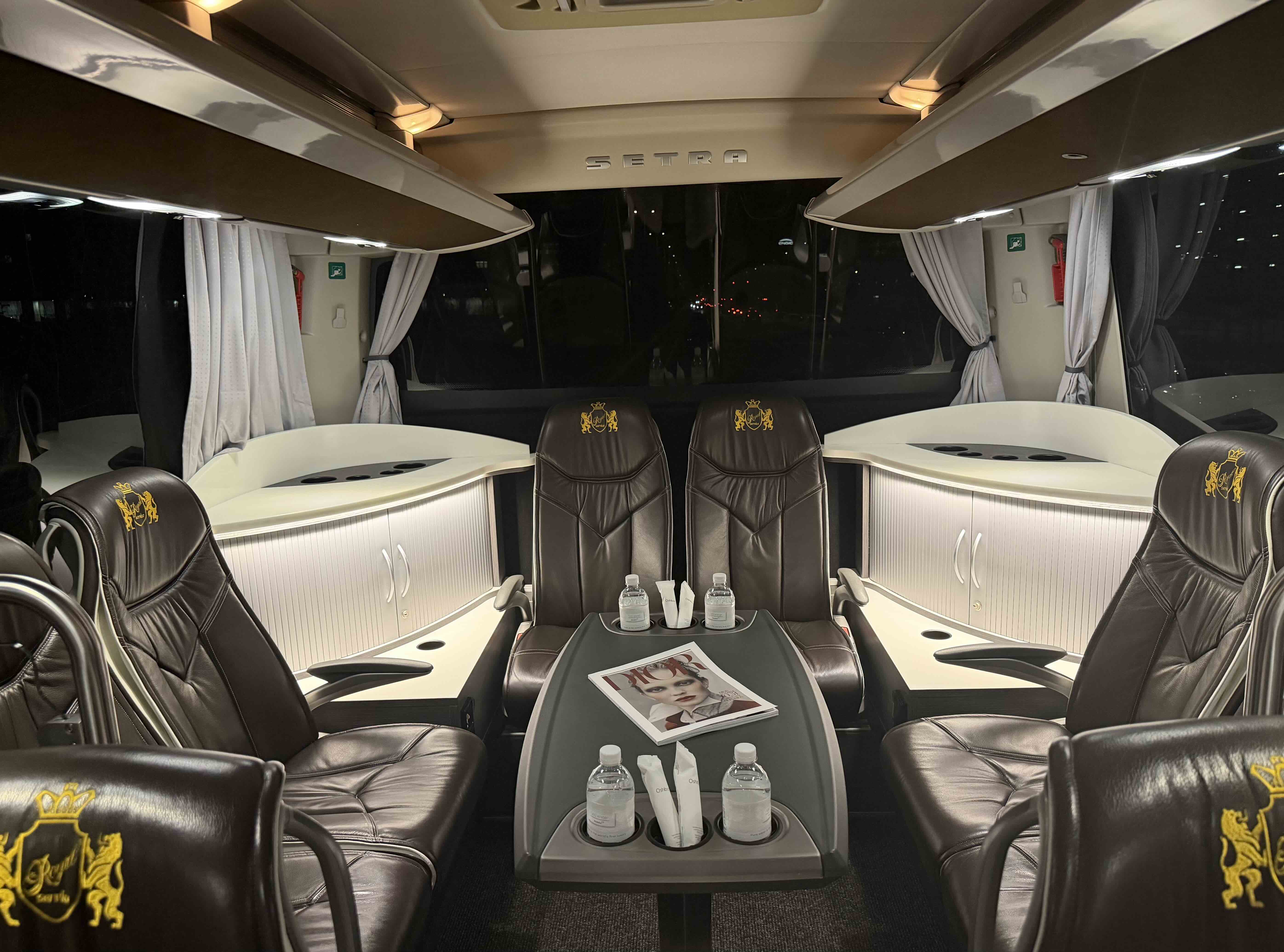 Lounge table layout inside the Moveolux Luxury Bus 28 for VIP group hospitality