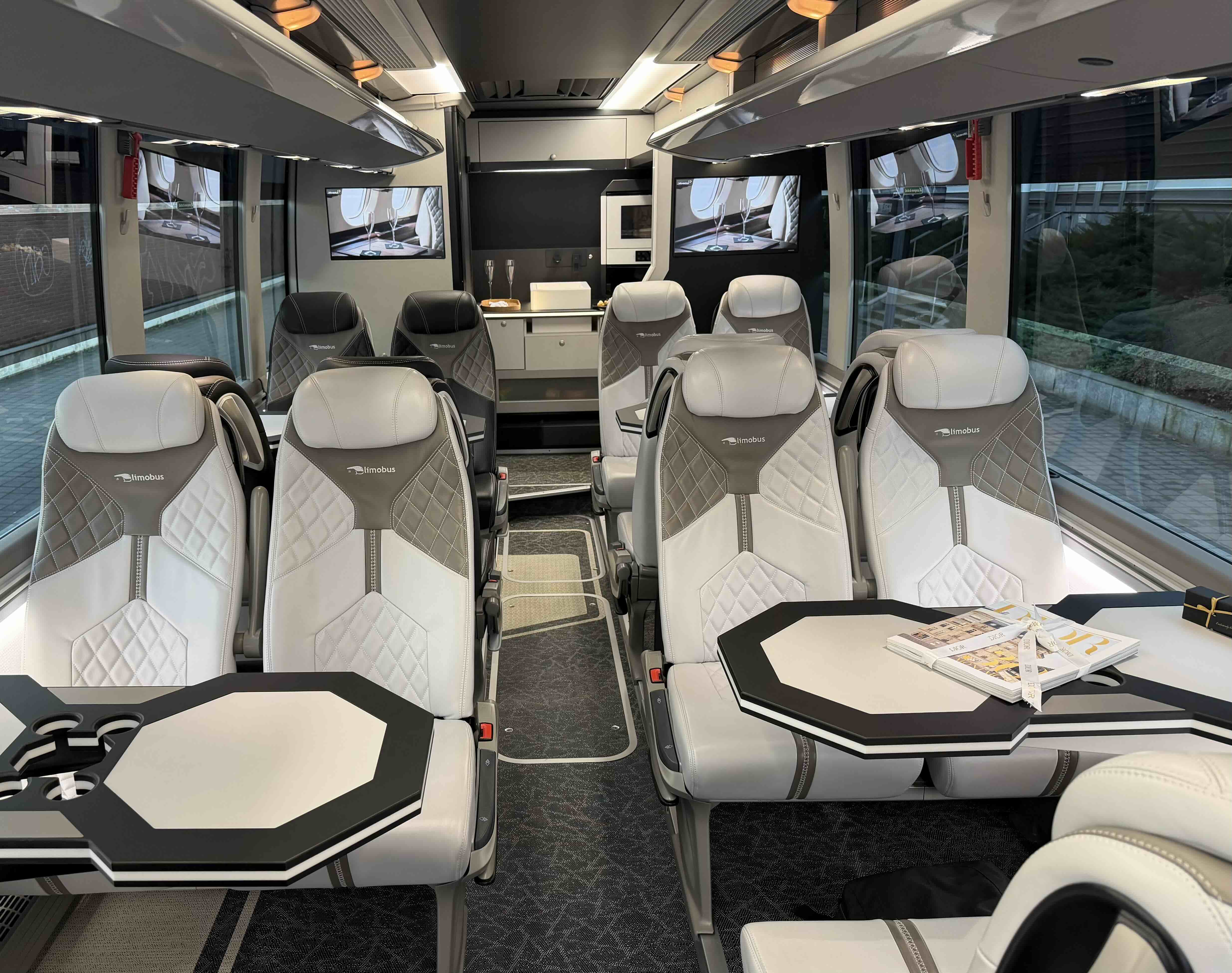 Premium seat layout inside the Moveolux Limobus Elements 20 with tables and lounge comfort