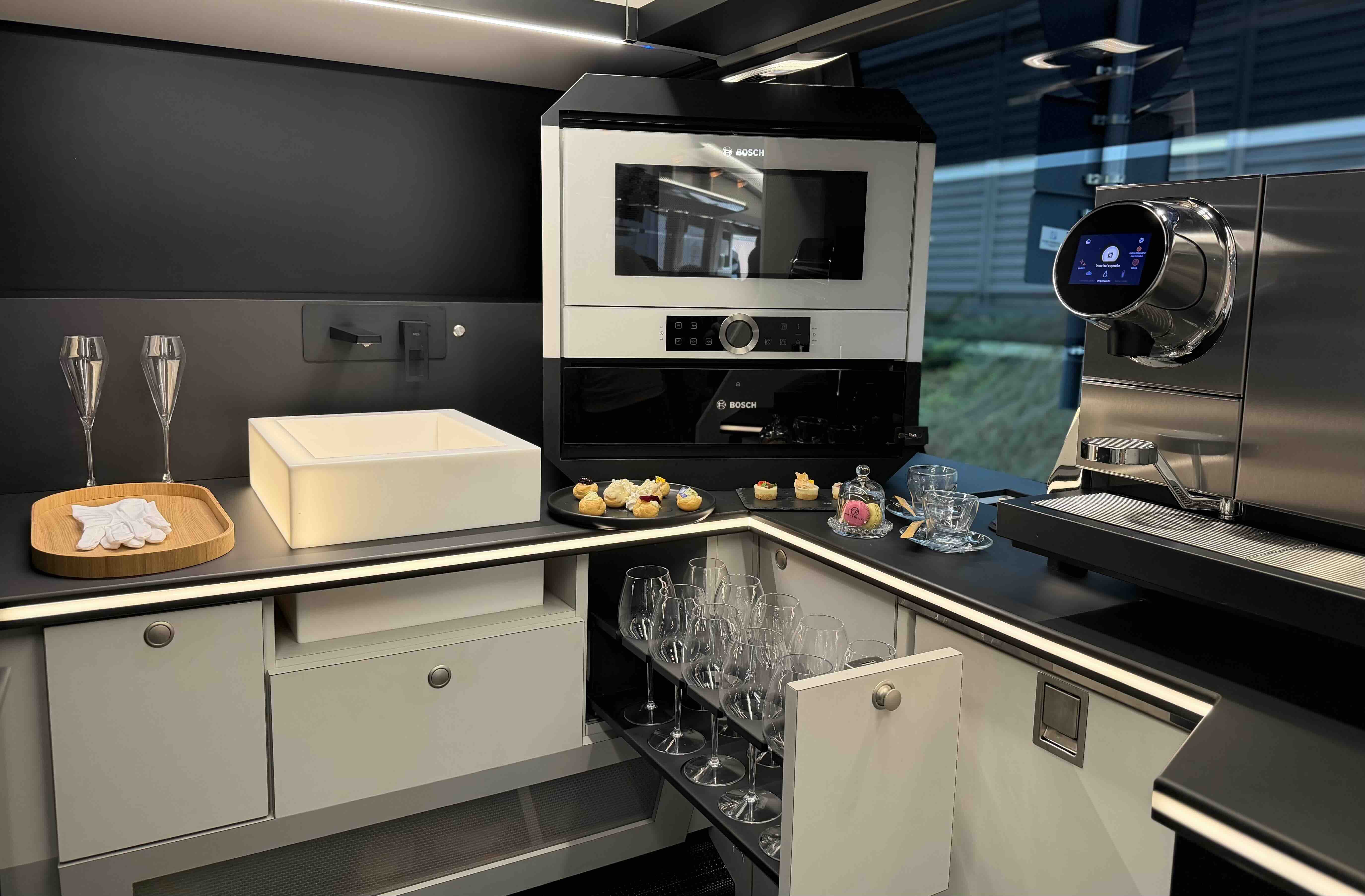 Bar and screen area inside the Moveolux Limobus Individuals 28 for premium onboard hospitality