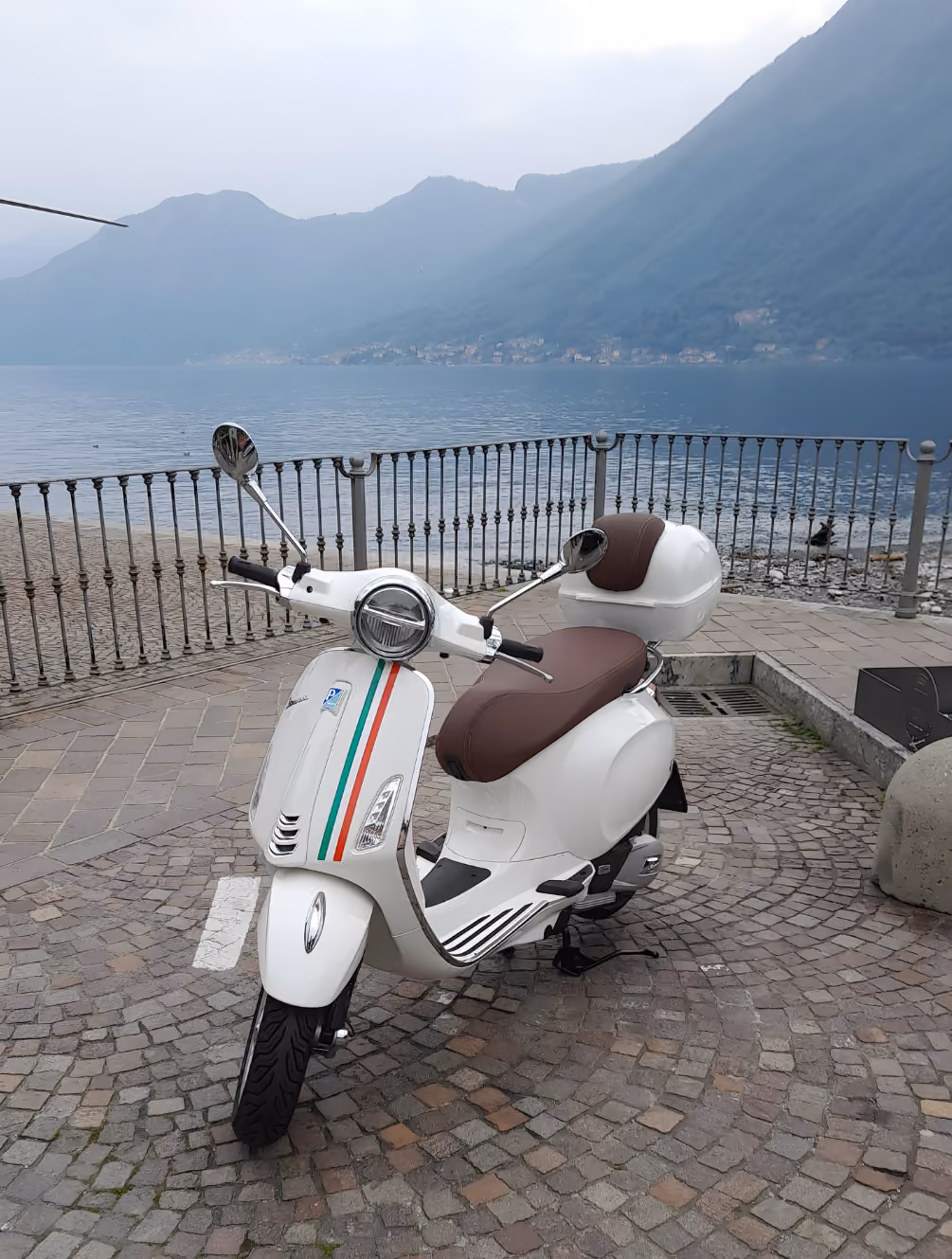 Vespa Primavera 125 with Lake Como view for premium scooter rental experiences