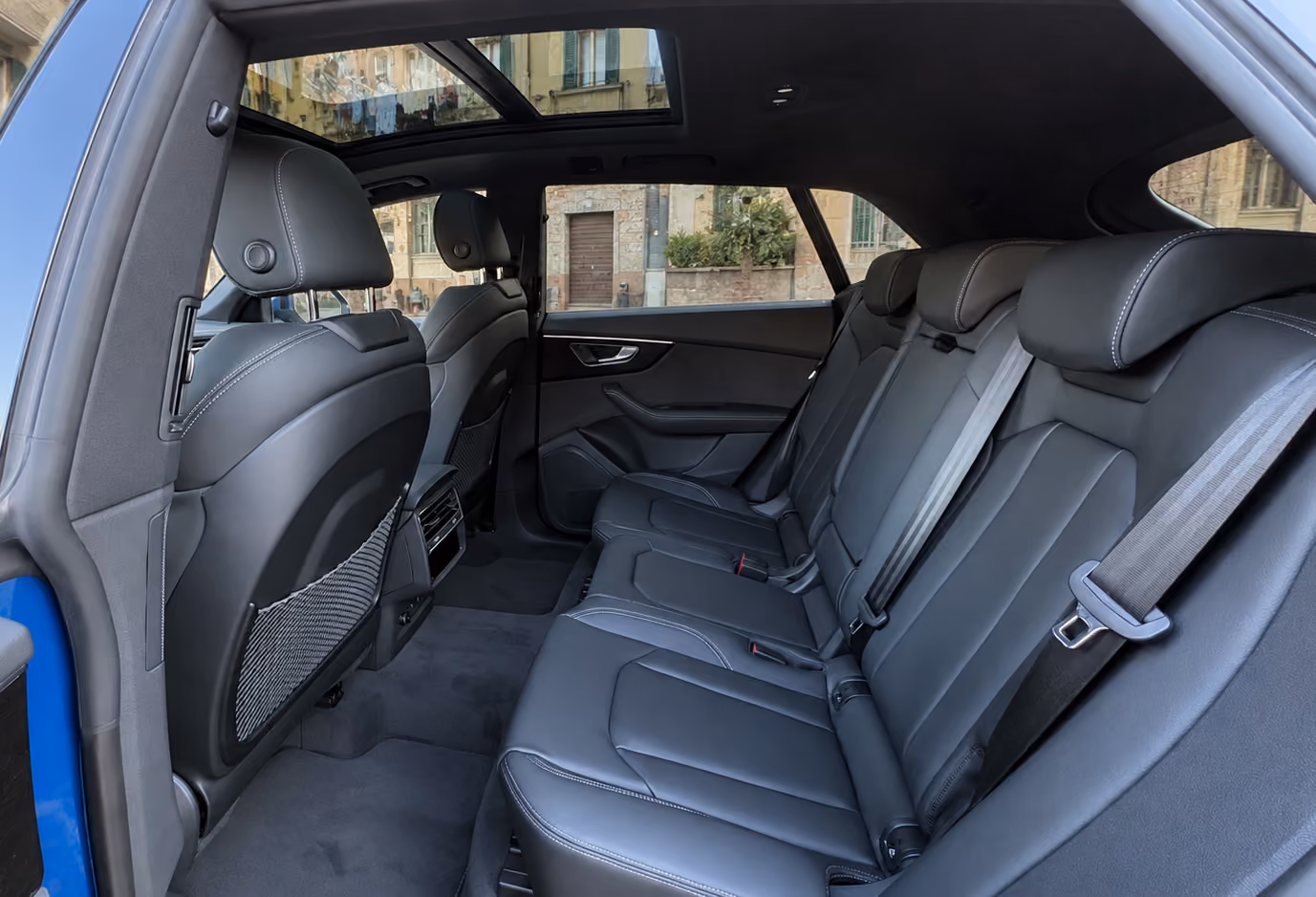 Rear passenger seats inside the Audi Executive Sedan with premium comfort for business travel