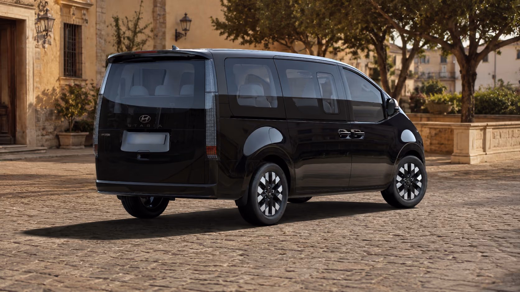 Side rear exterior view of the Hyundai Staria for practical premium self-drive rental