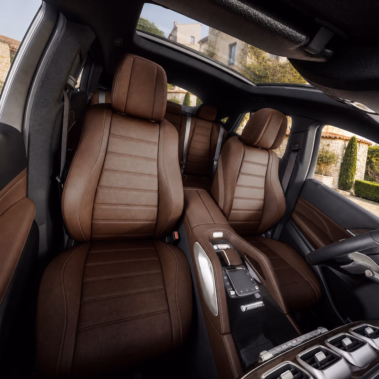 Brown leather interior of the Mercedes Performance SUV with premium passenger comfort