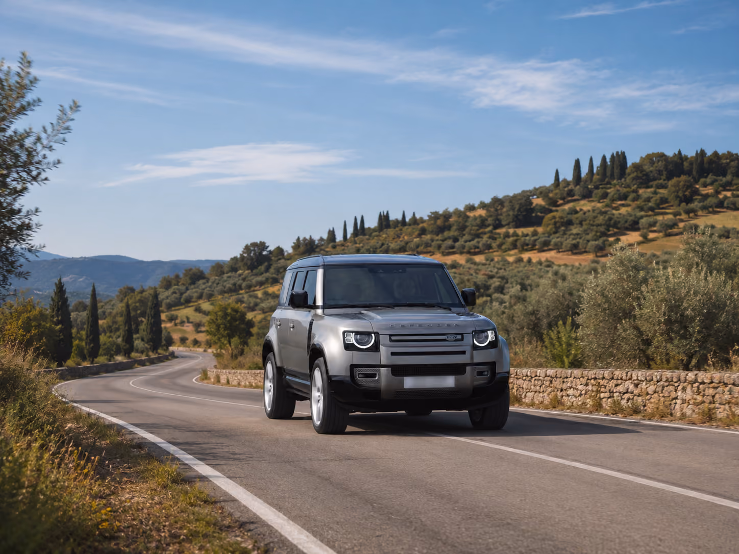 Front view of the Range Rover Performance SUV on a scenic road for luxury self-drive rental