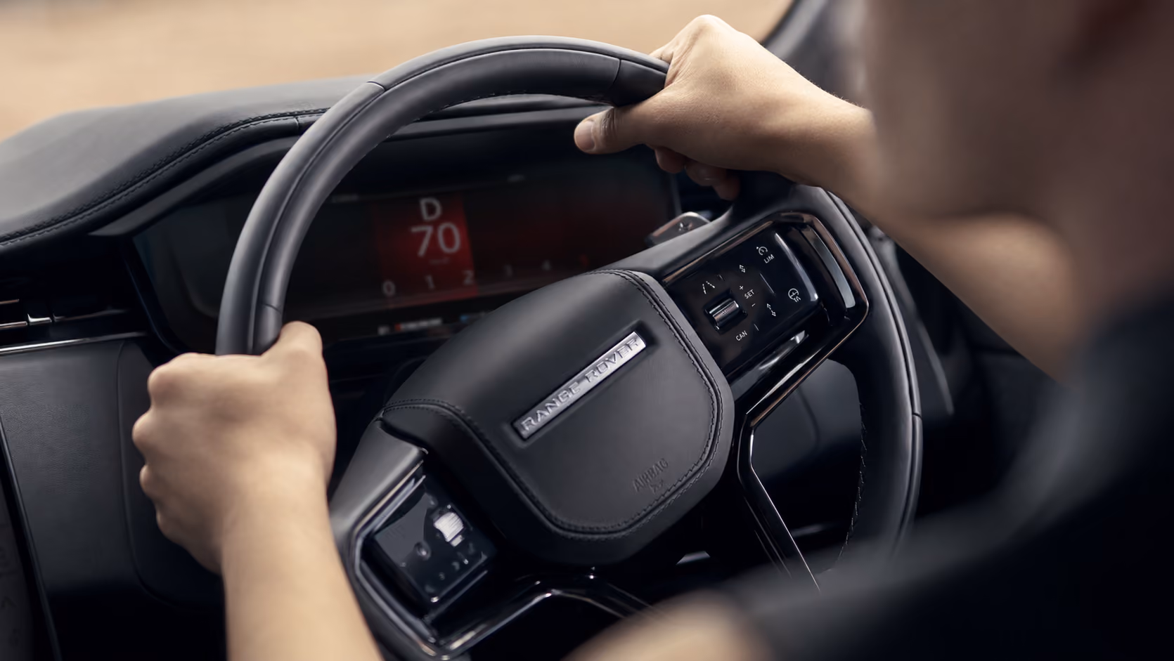 Steering wheel detail of the Range Rover Performance SUV during a self-drive experience
