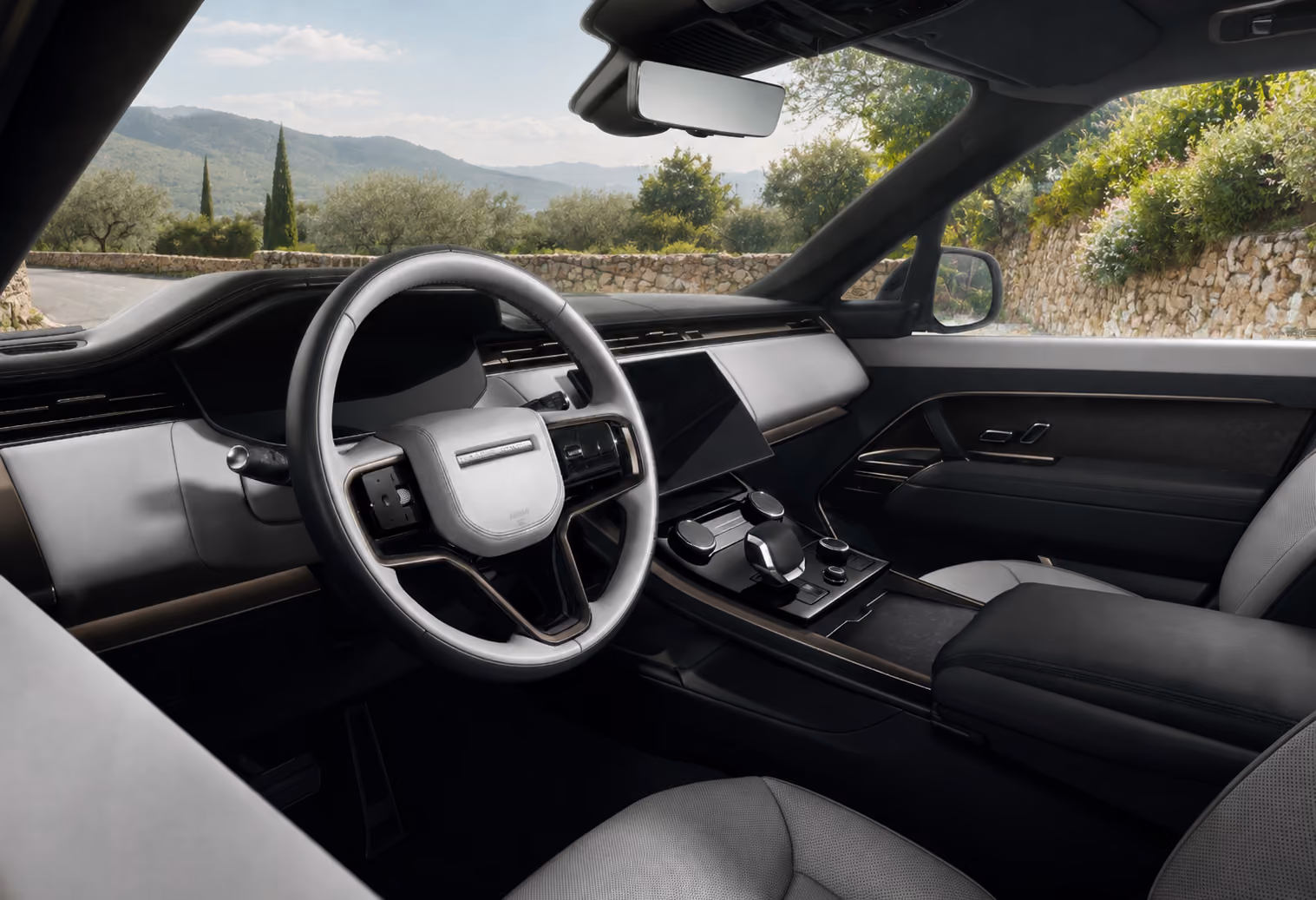 Front cabin interior of the Range Rover Performance SUV with refined dashboard and controls