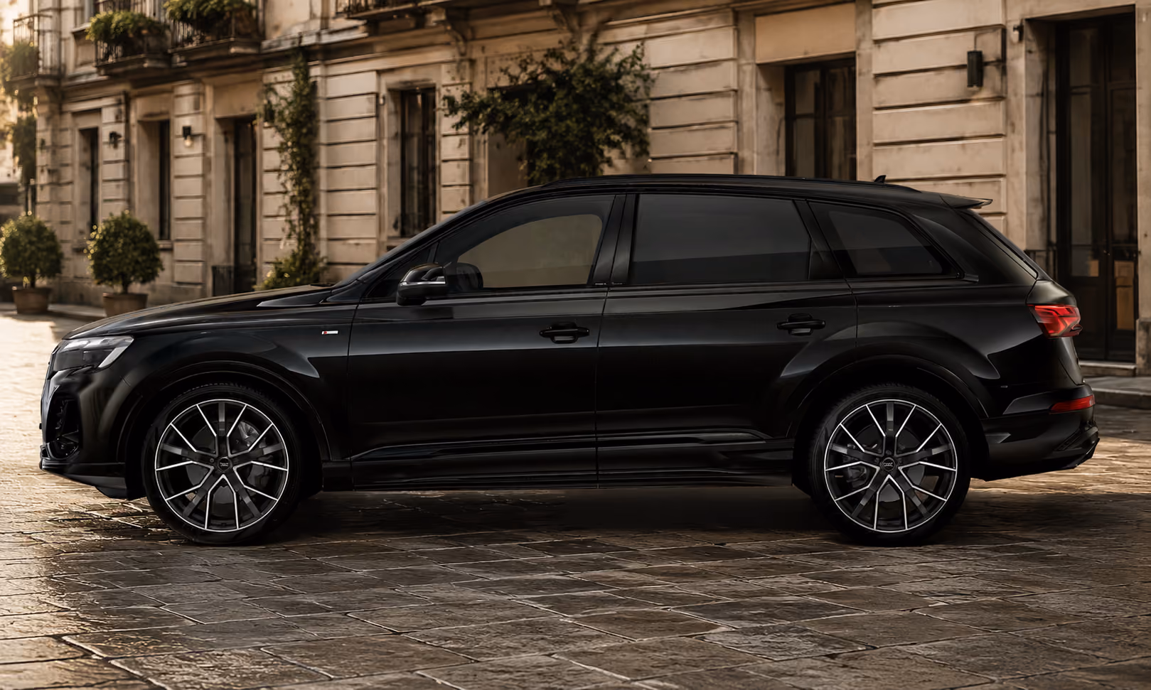 Black Audi Performance SUV side profile for elegant city travel and premium self-drive rental