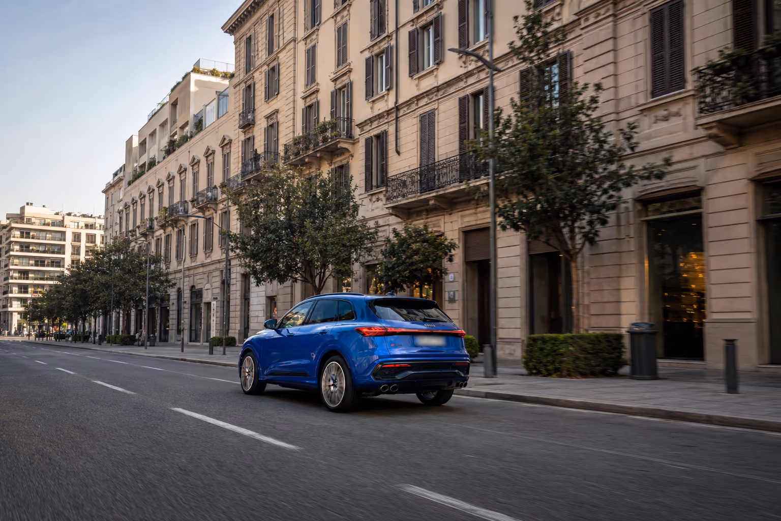 Rear exterior view of the Audi Performance SUV in the city for premium self-drive mobility