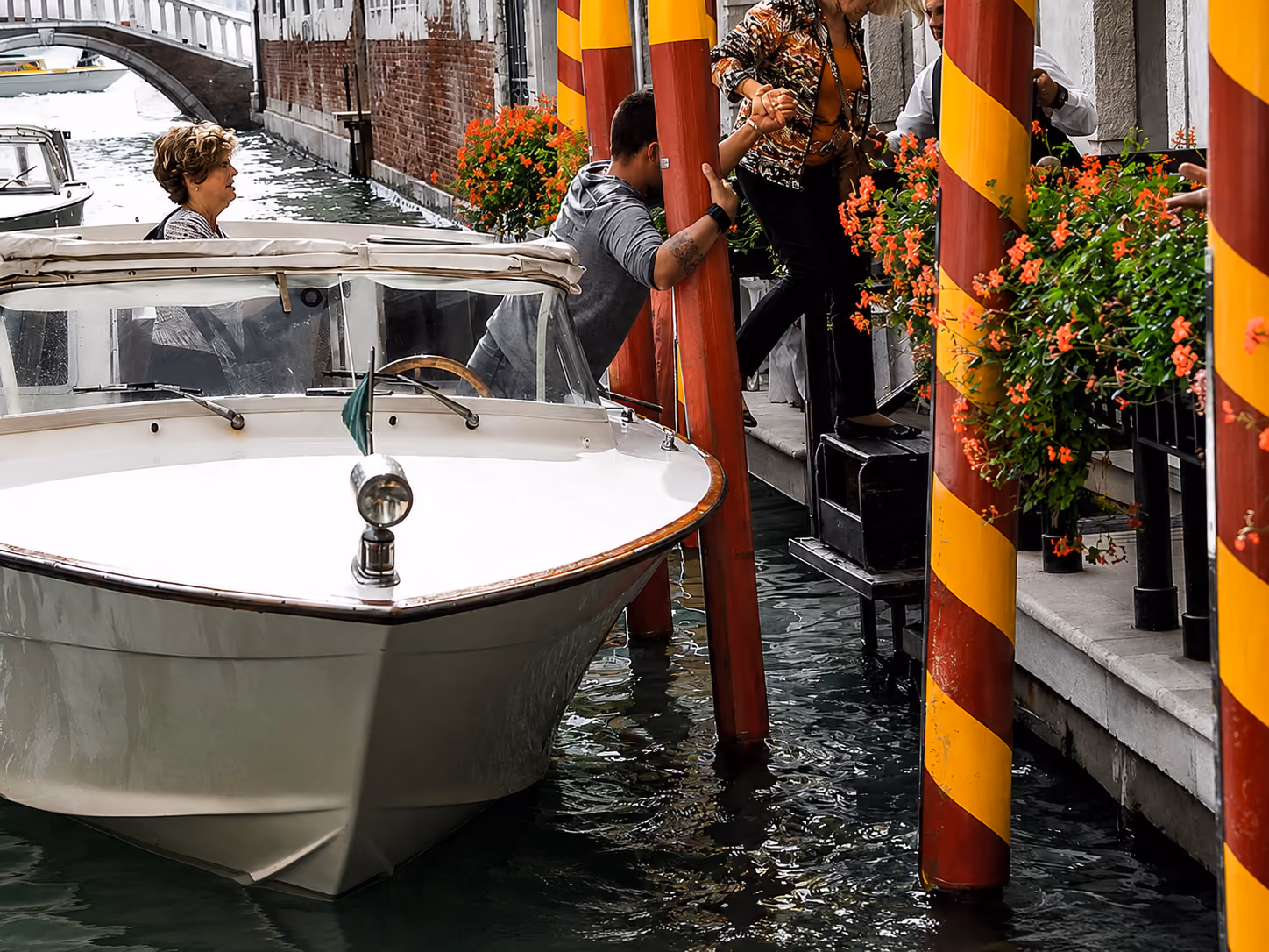 Venice standard taxi boat docking for private water transfer and passenger boarding