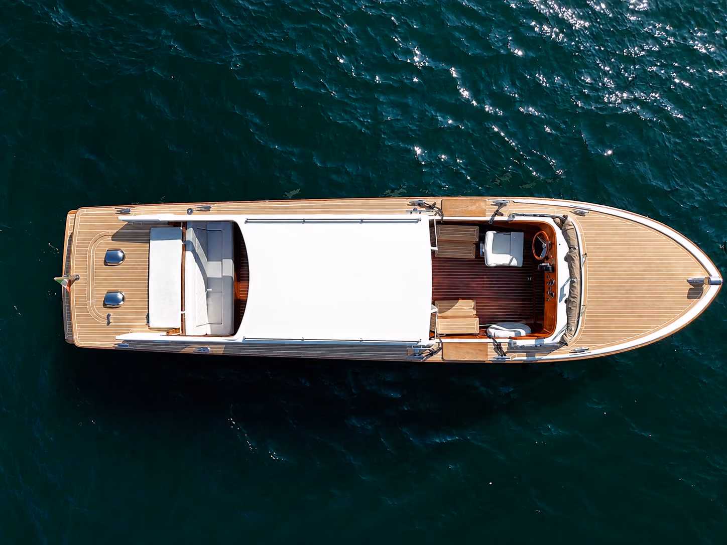 Aerial top view of a Lake Como luxury speedboat for premium private water taxi service