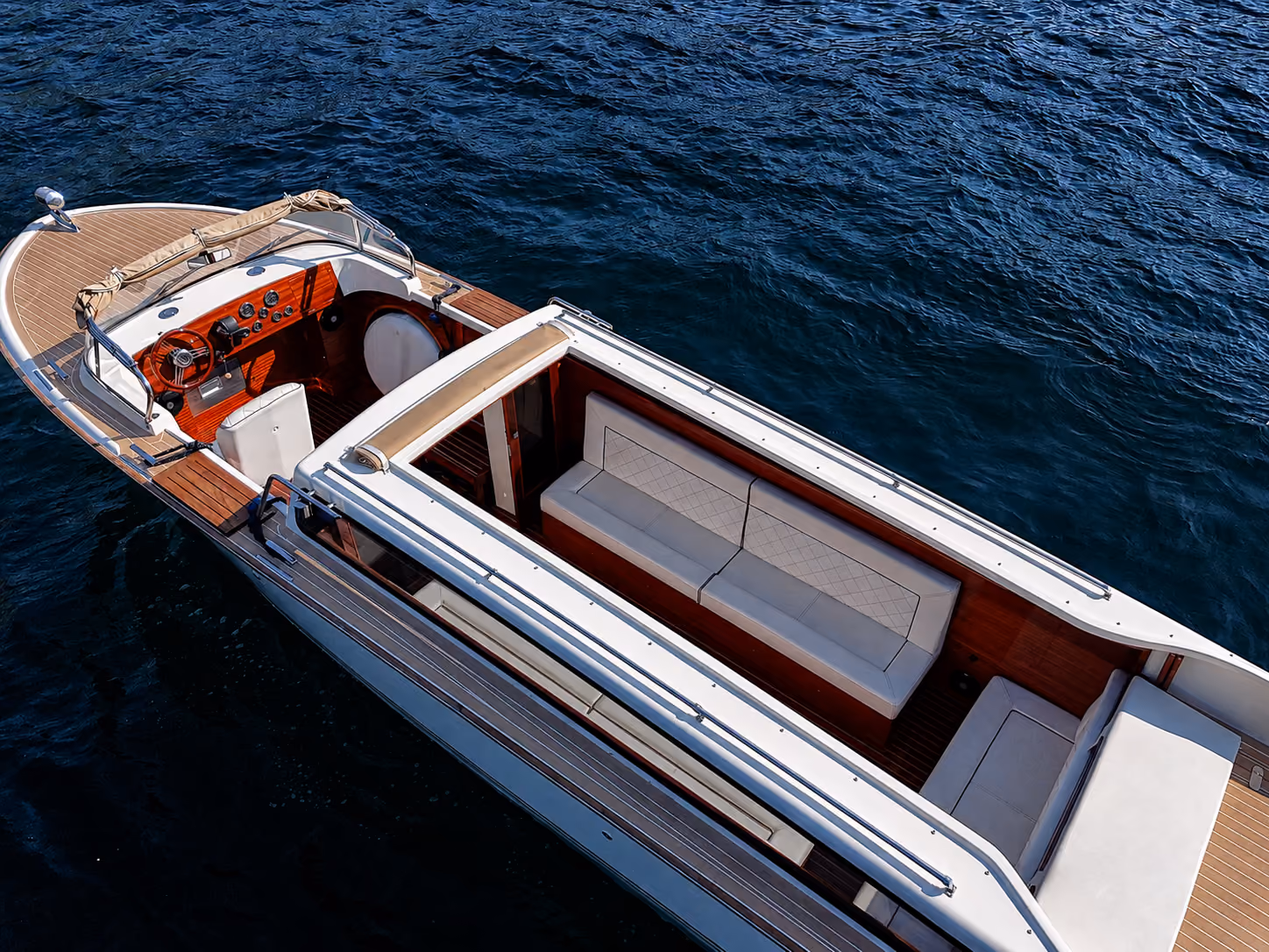 Top view of the interior of a Lake Como luxury speedboat with elegant seating