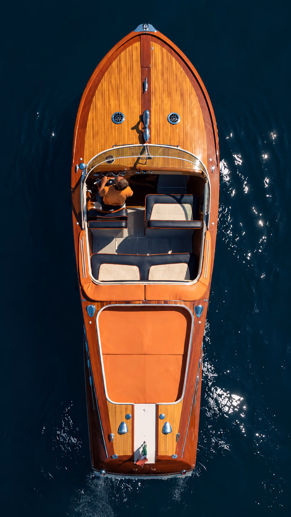 Aerial passenger view of a Riva boat on Lake Como during an exclusive private tour