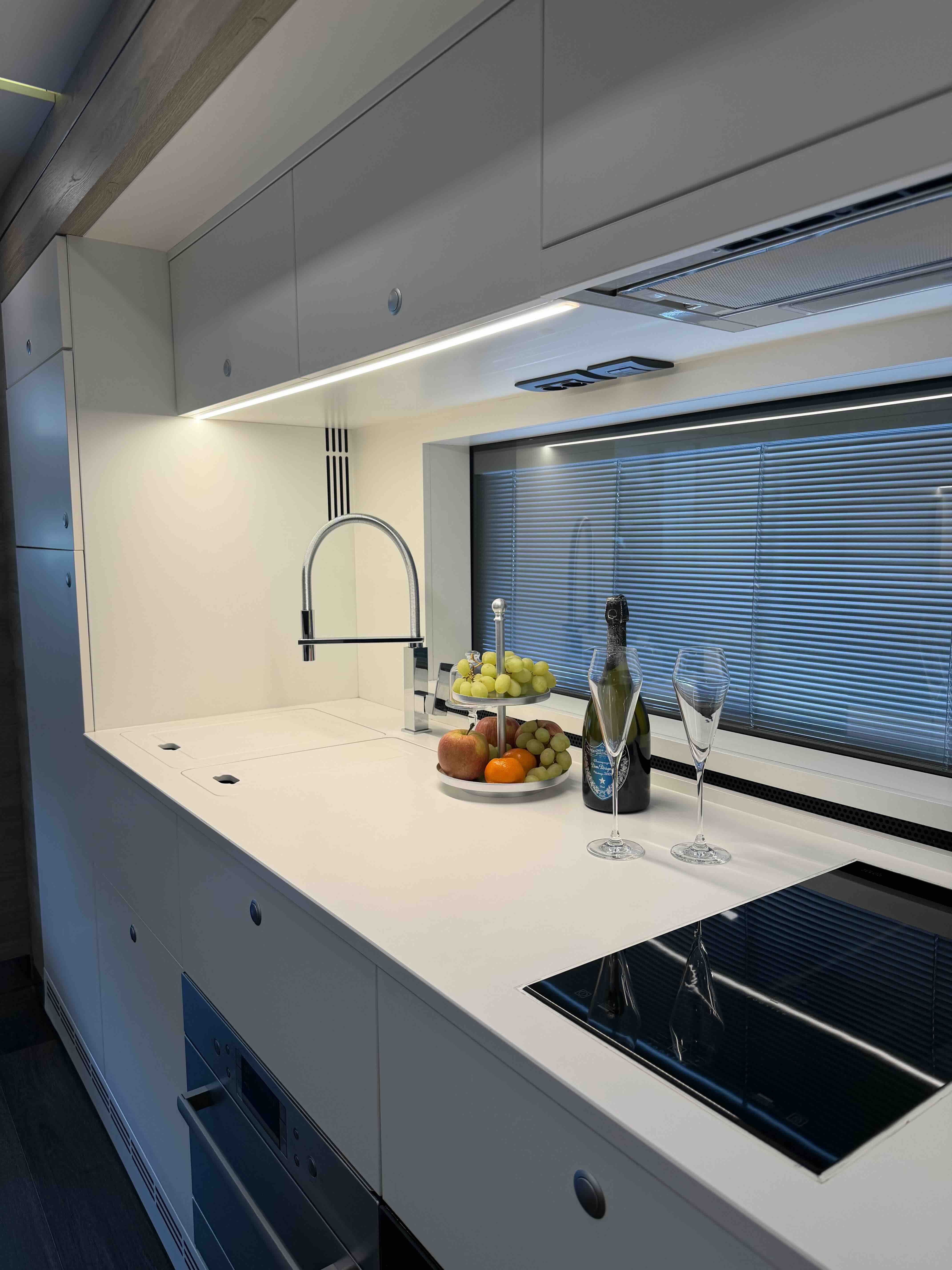 Kitchen area inside the Mercedes Actros STX luxury motorhome for productions and mobile hospitality