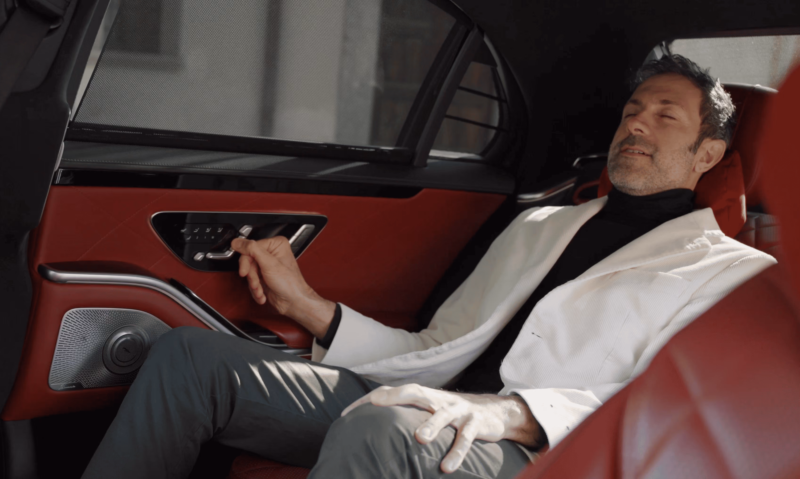 Rear passenger experience inside the Mercedes S-Class during a luxury chauffeur service