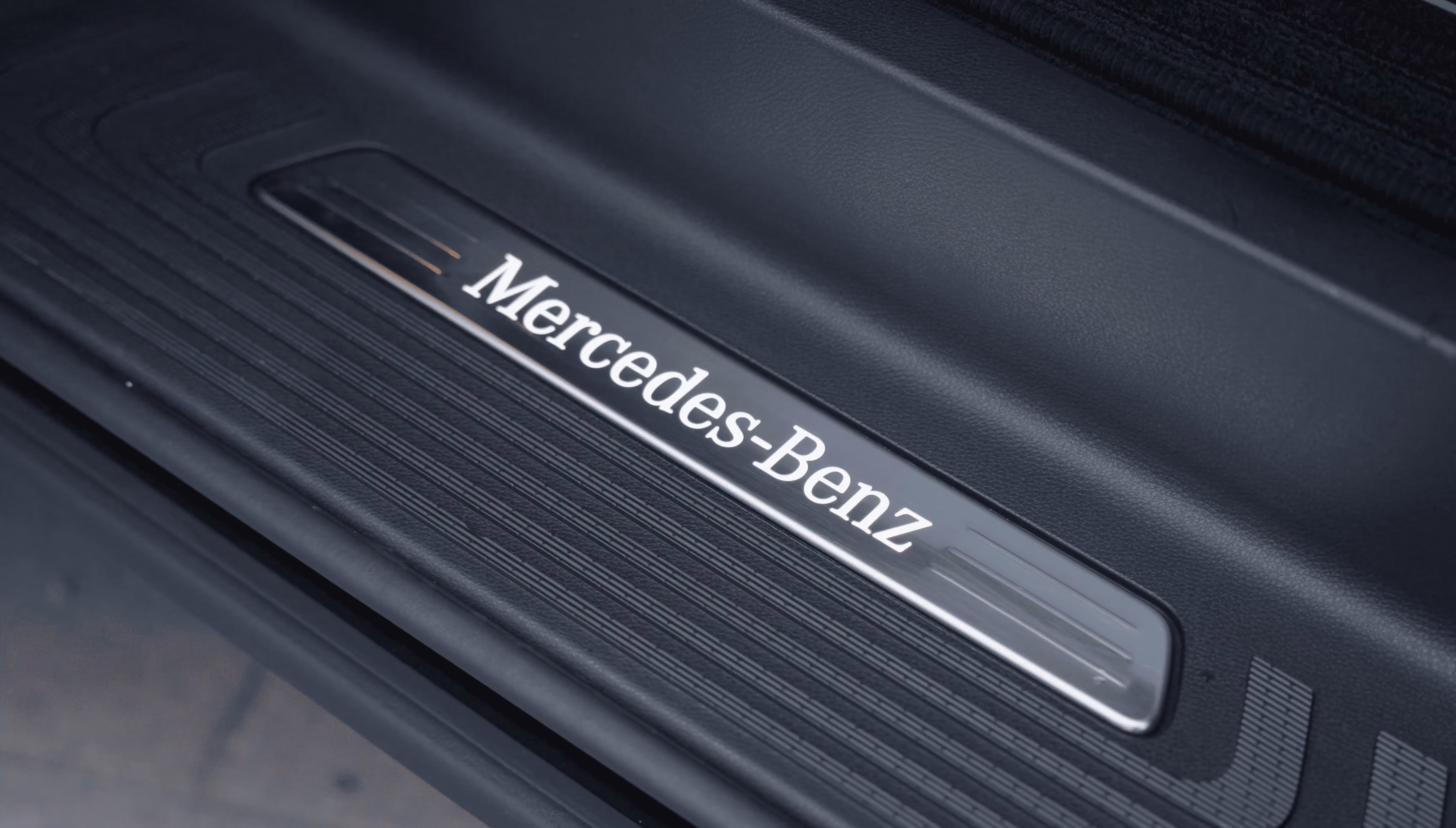 Door sill detail of the Mercedes V-Class Black with Mercedes-Benz branding