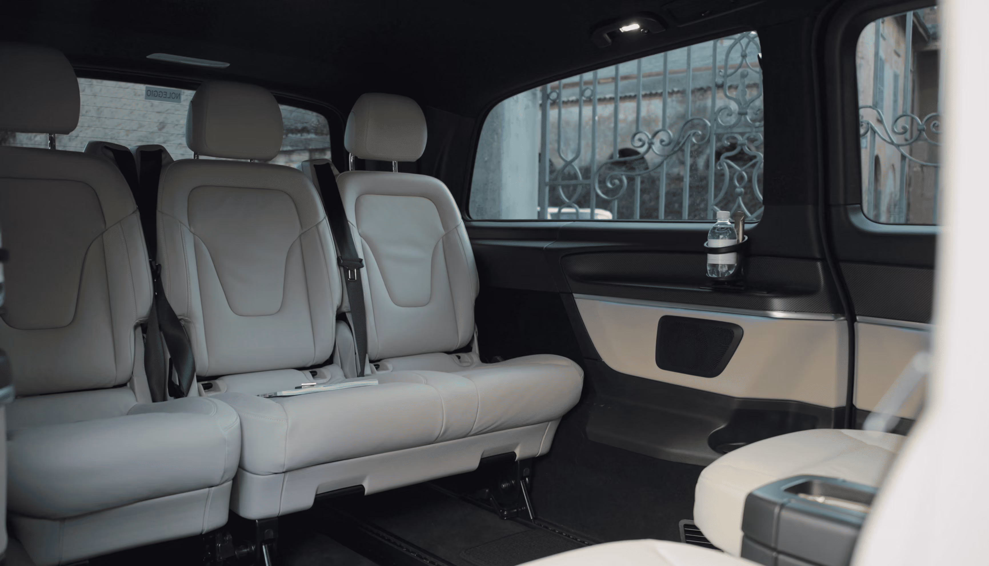 Onboard bottled water detail inside the Mercedes V-Class Light for premium passenger comfort