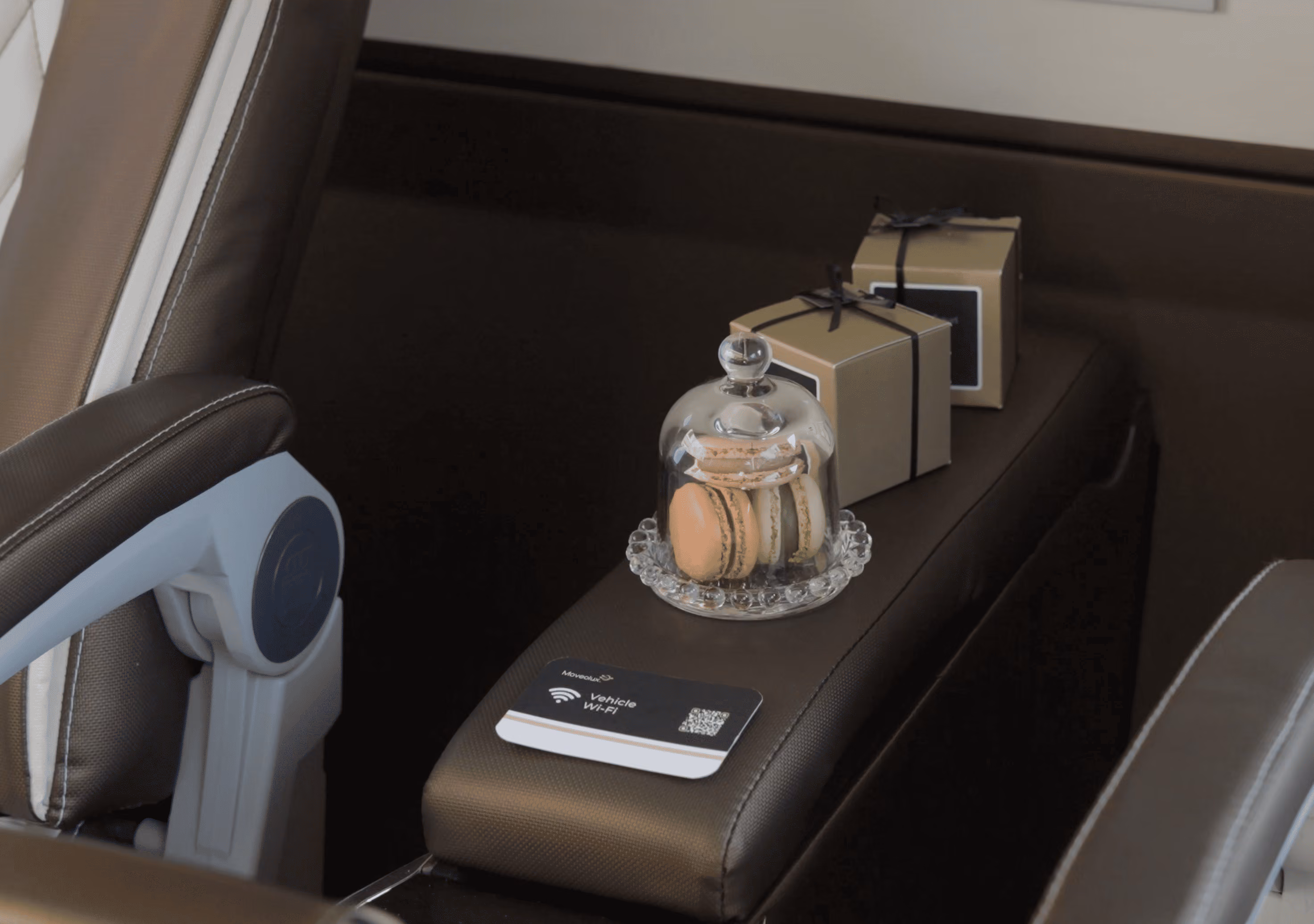 Onboard amenities inside the Moveolux Limovan Light Edition with refreshments and travel essentials