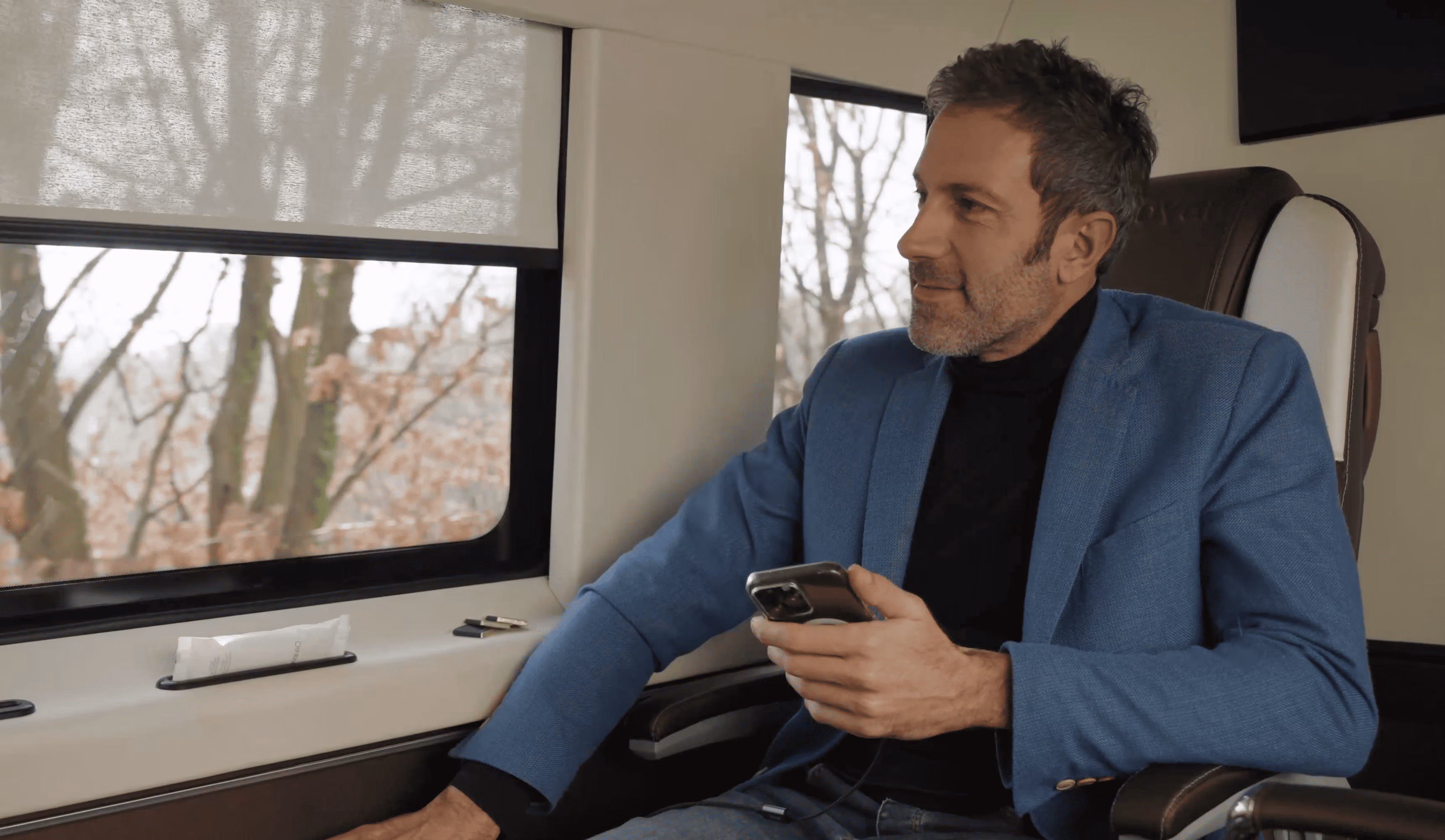 Business passenger inside the Moveolux Limovan Light Edition during a premium private transfer