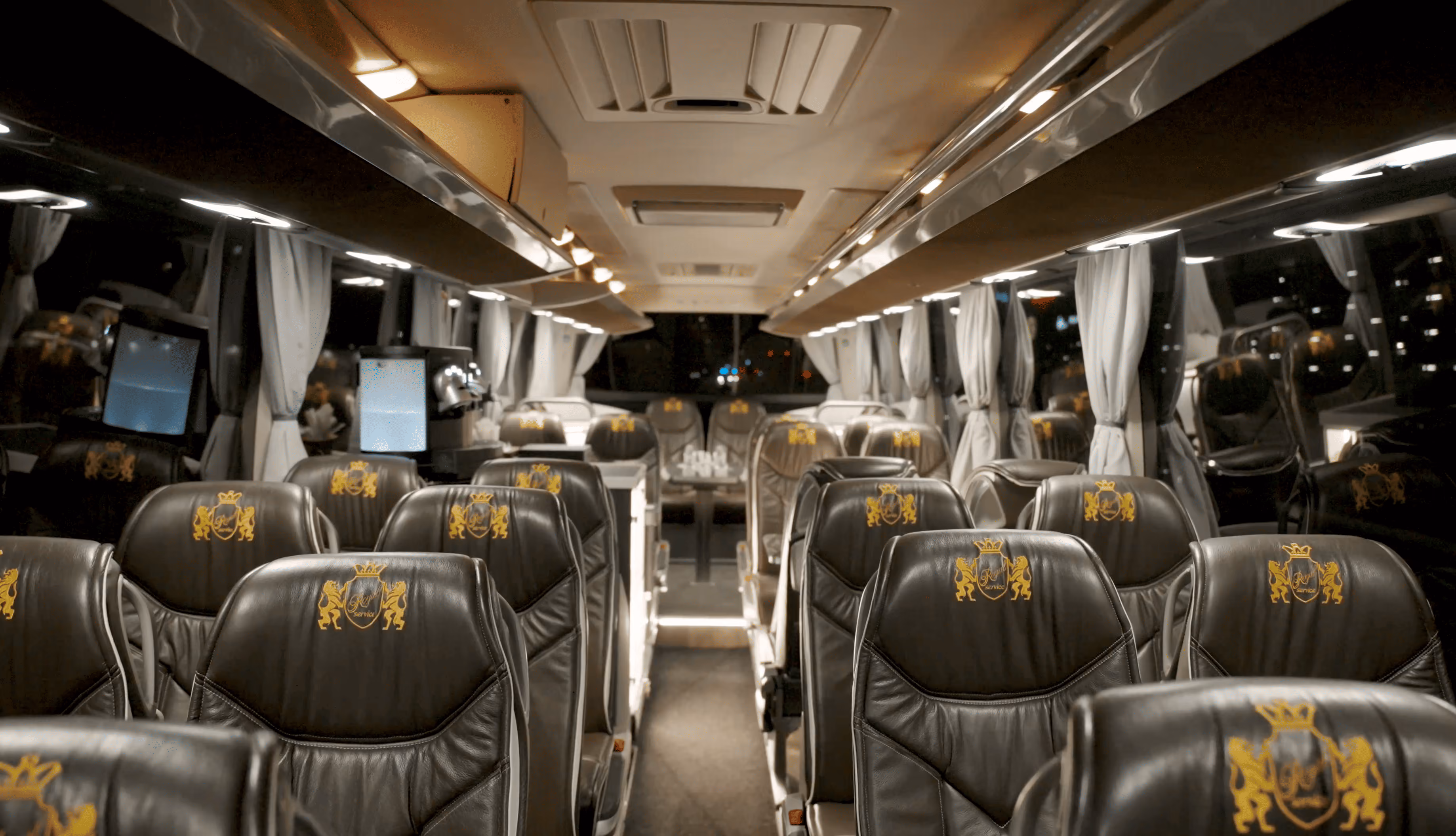 Spacious cabin view inside the Moveolux Luxury Bus 28 with premium passenger seating