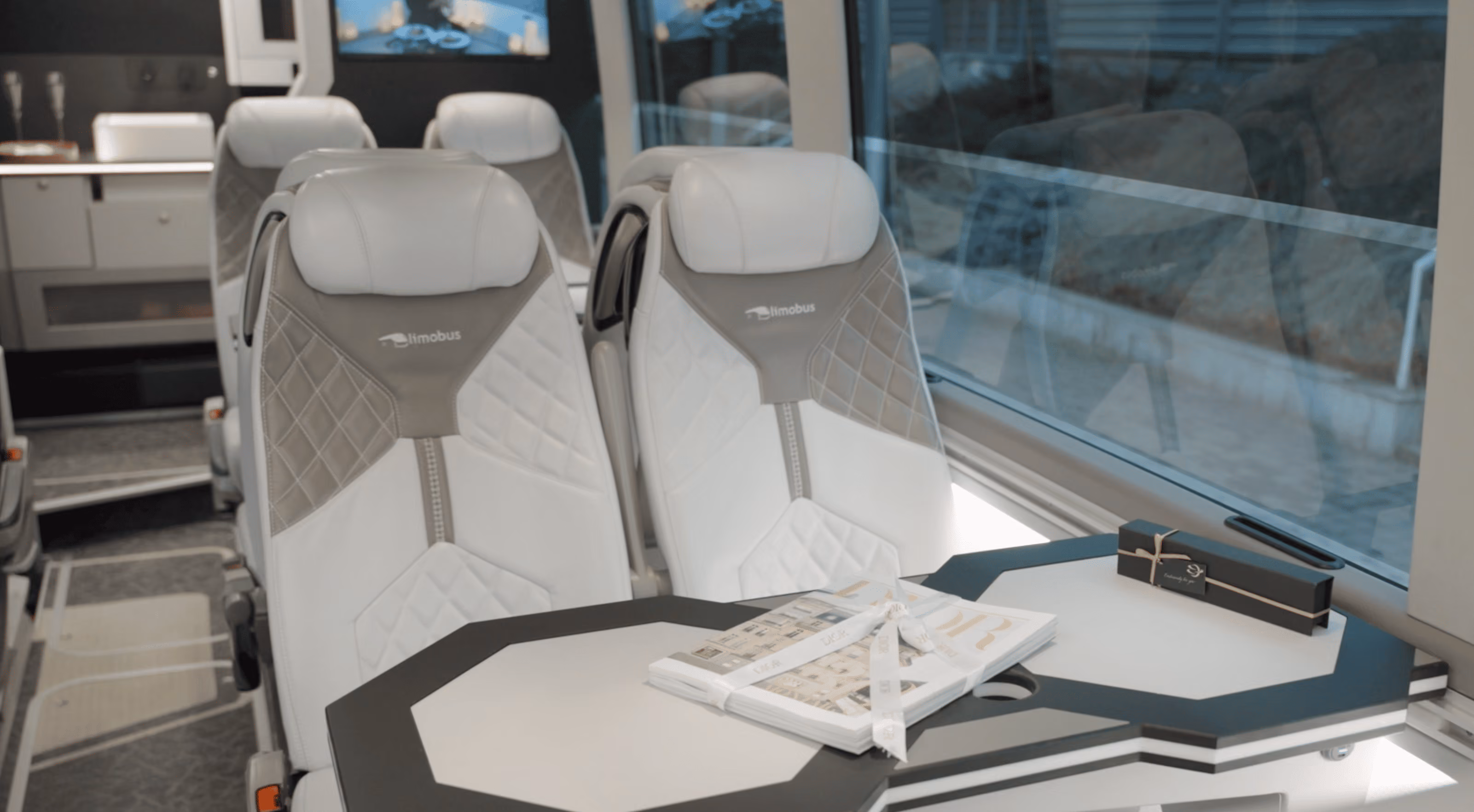 Table and magazine detail inside the Moveolux Limobus Elements 20 lounge area