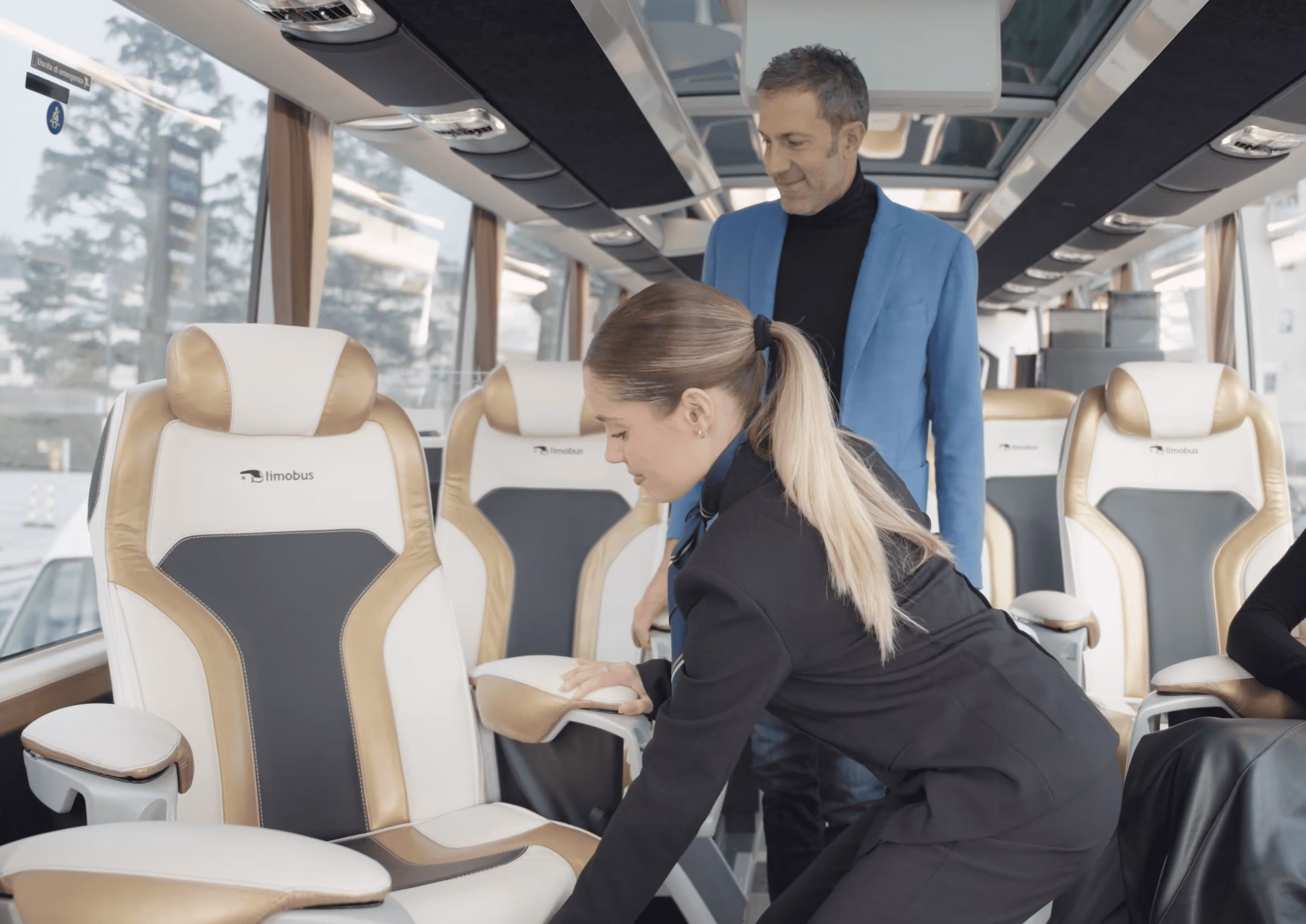 Hostess welcome service inside the Moveolux Limobus Individuals 28 for VIP group hospitality