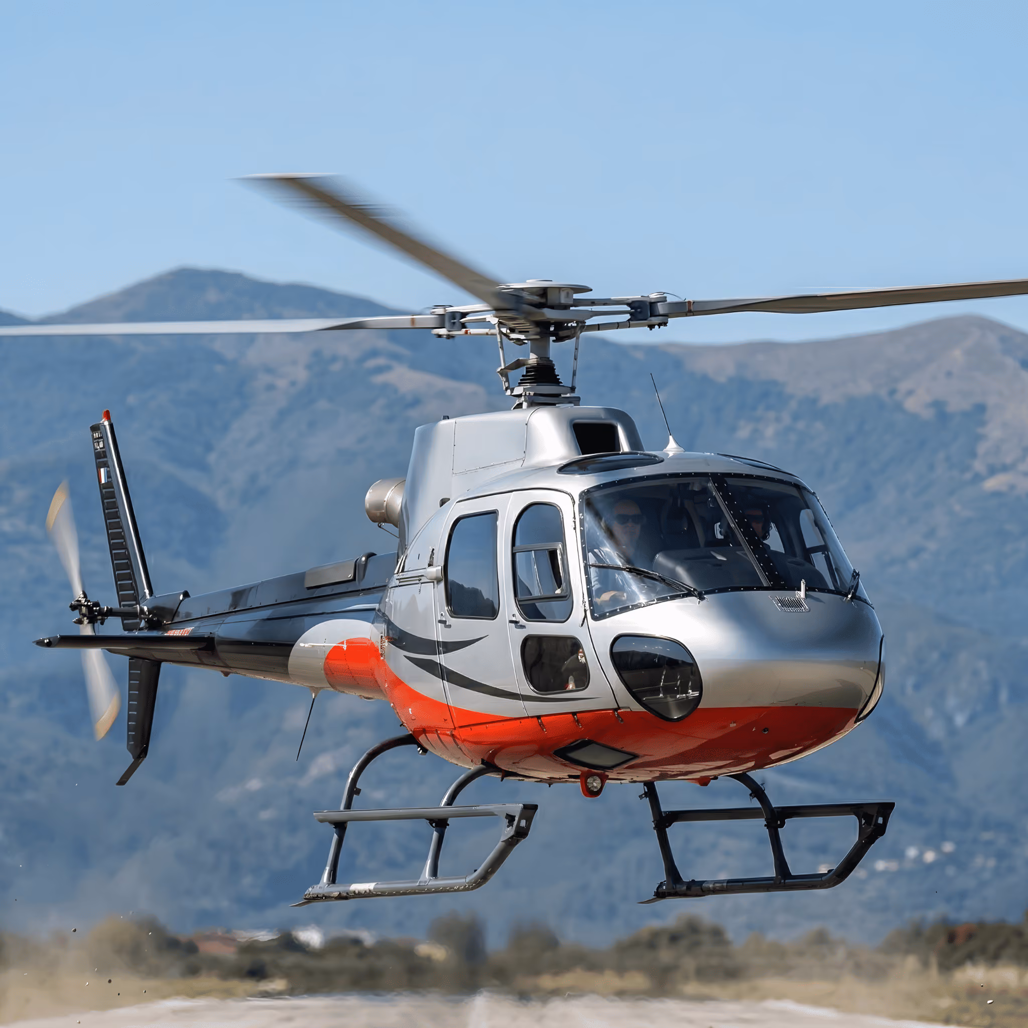 Airbus H125 helicopter in flight for private transfers, helitours and panoramic travel