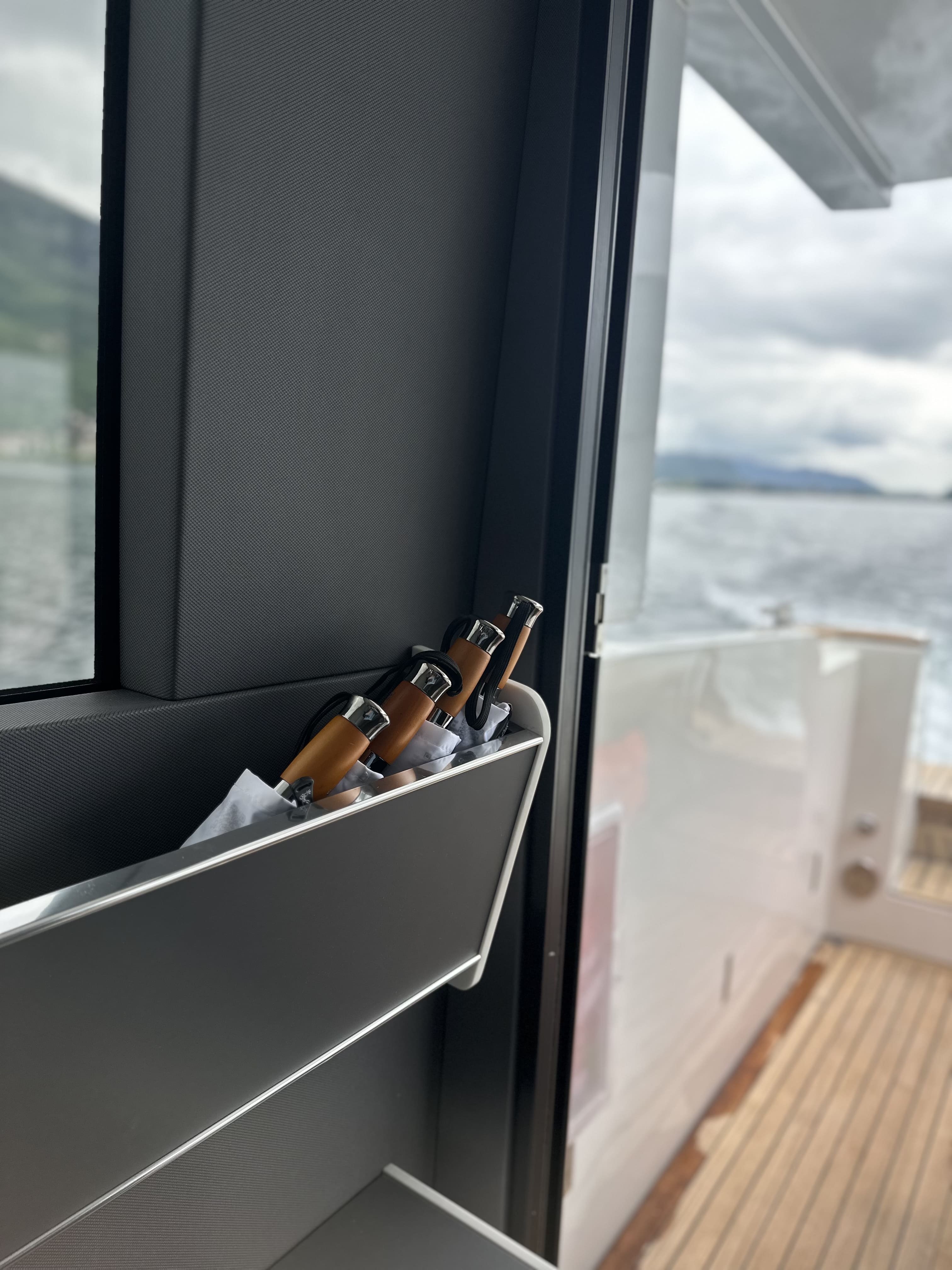 Window detail inside the Moveolux Limotender with view of the lake and elegant onboard design