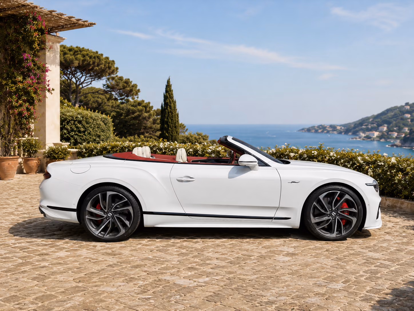 Side profile of a Bentley iconic convertible car with open top for luxury self-drive travel