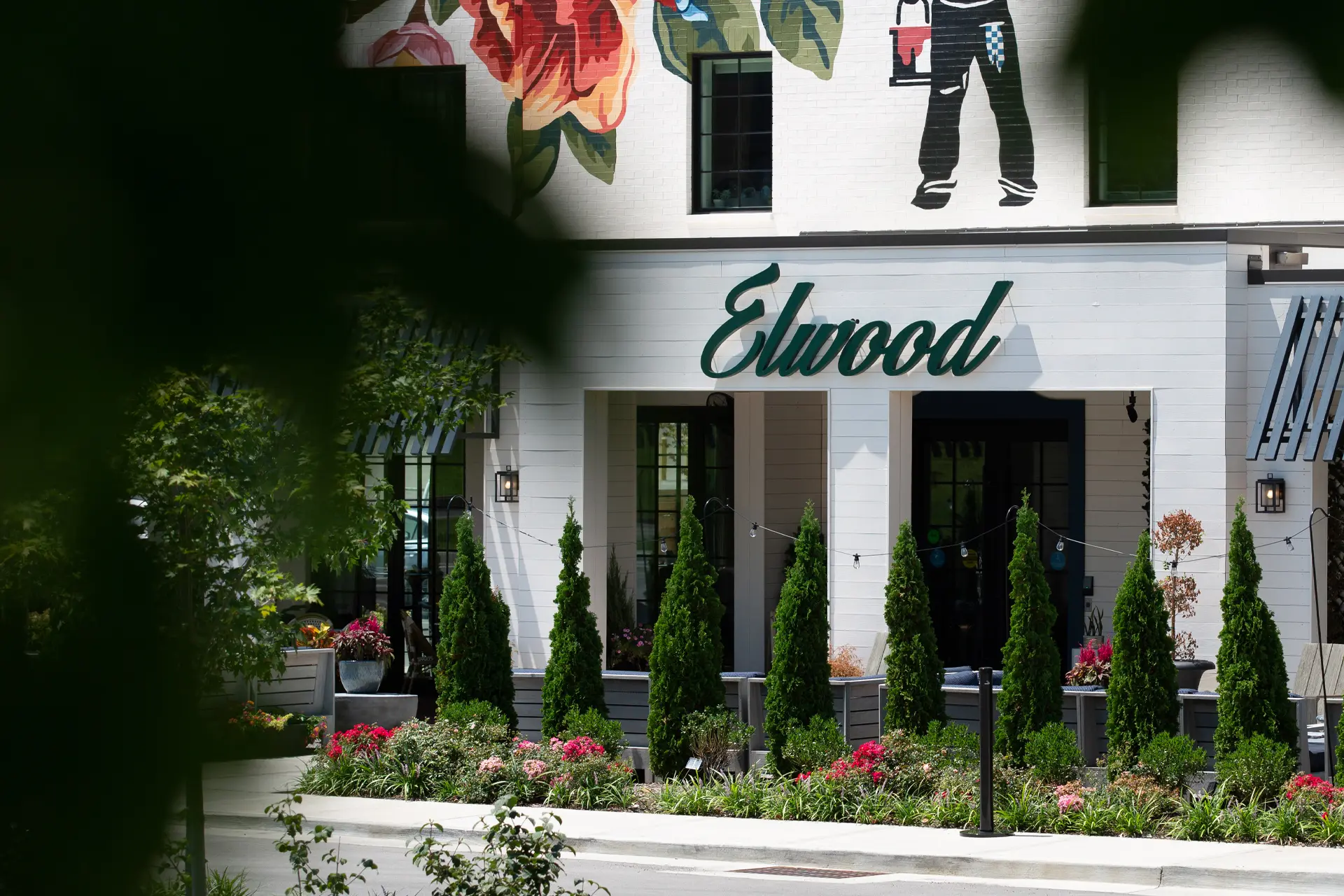 Elwood hotel in Lexington, KY The image shows the hotel's elegant brick facade, with a sign above the entrance displaying the hotel's name.