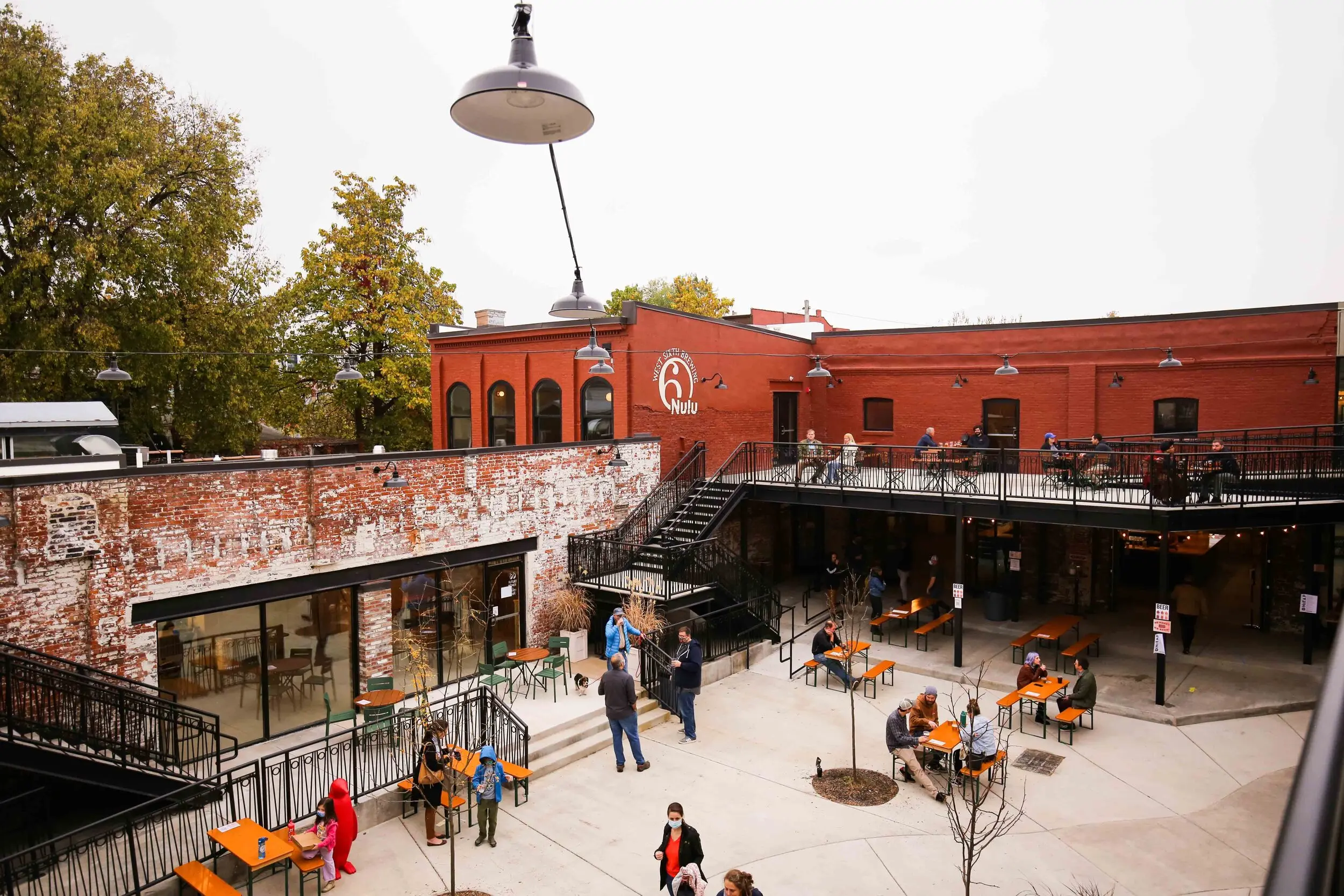 Image of West Sixth Nulu located in Louisville, Kentucky. The taproom offers a spacious and stylish setting, with an an open-air courtyard.
