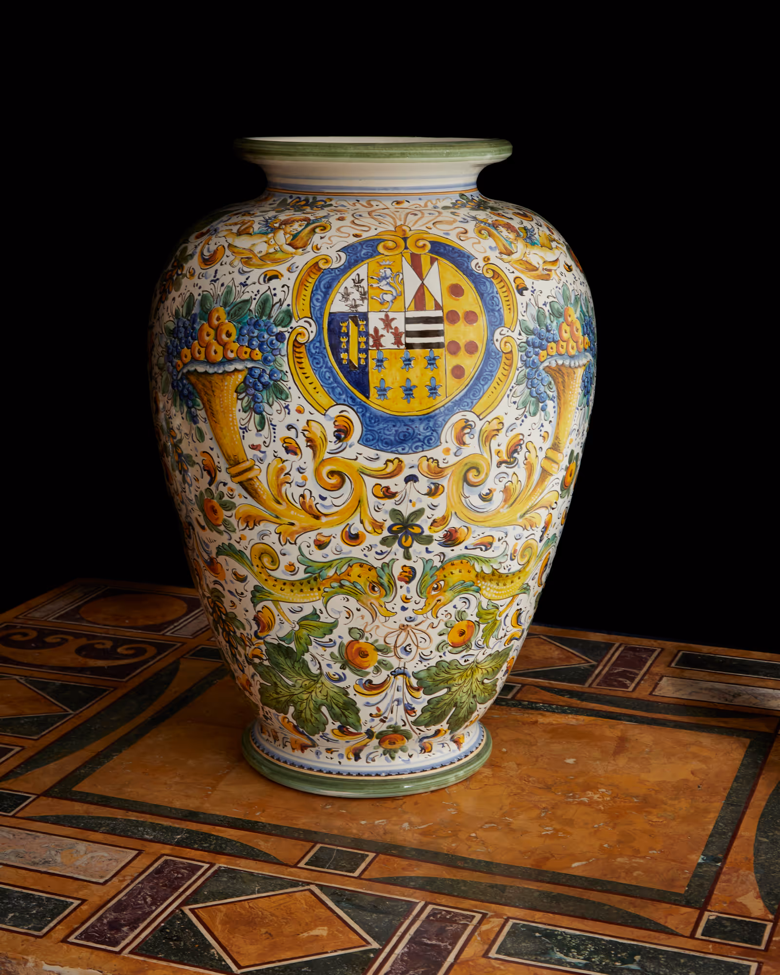 The largest Montelupo vase in the collection, featuring complex heraldry and cornucopias; a monumental display of Renaissance dynastic power.