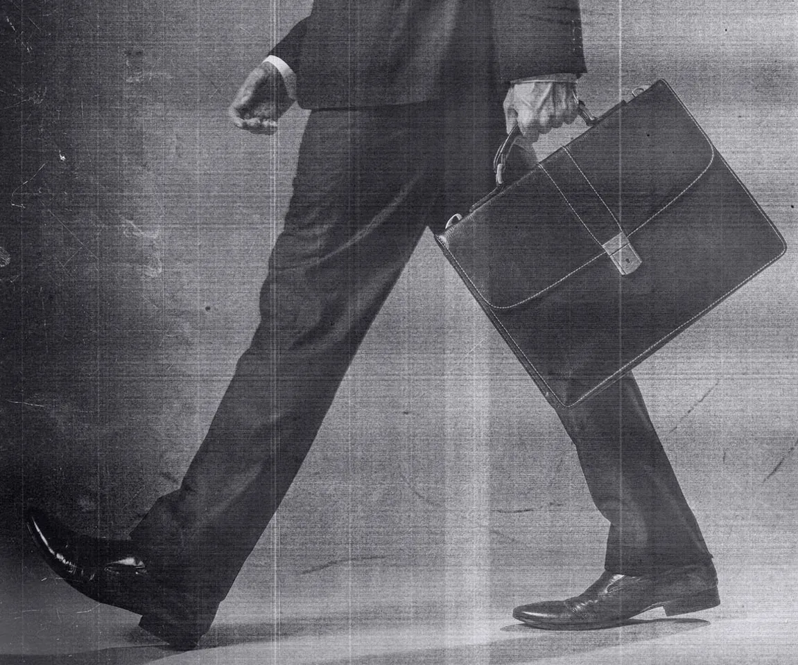 man in suit with briefcase