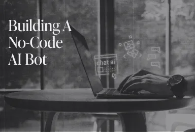 Person typing on a laptop with the text 'Building A No-Code AI Bot' displayed on the left.