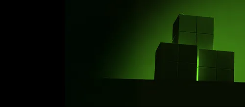 Green-lit stacked cubes with smooth surfaces against a dark gradient background.
