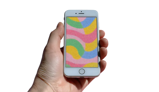 Hand holding a smartphone displaying a colorful abstract pattern with curved shapes in green, pink, yellow, and blue.