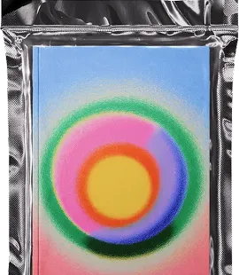 Colorful abstract painting with concentric circles in yellow, orange, pink, green, and blue on a vertical rectangular canvas, placed on a silver textured surface.
