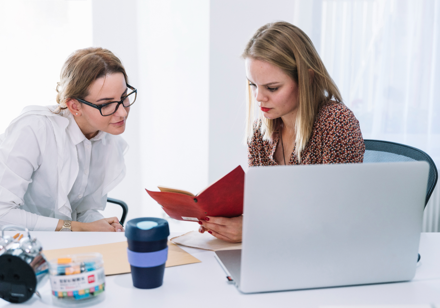 Two employees engaged in training together.