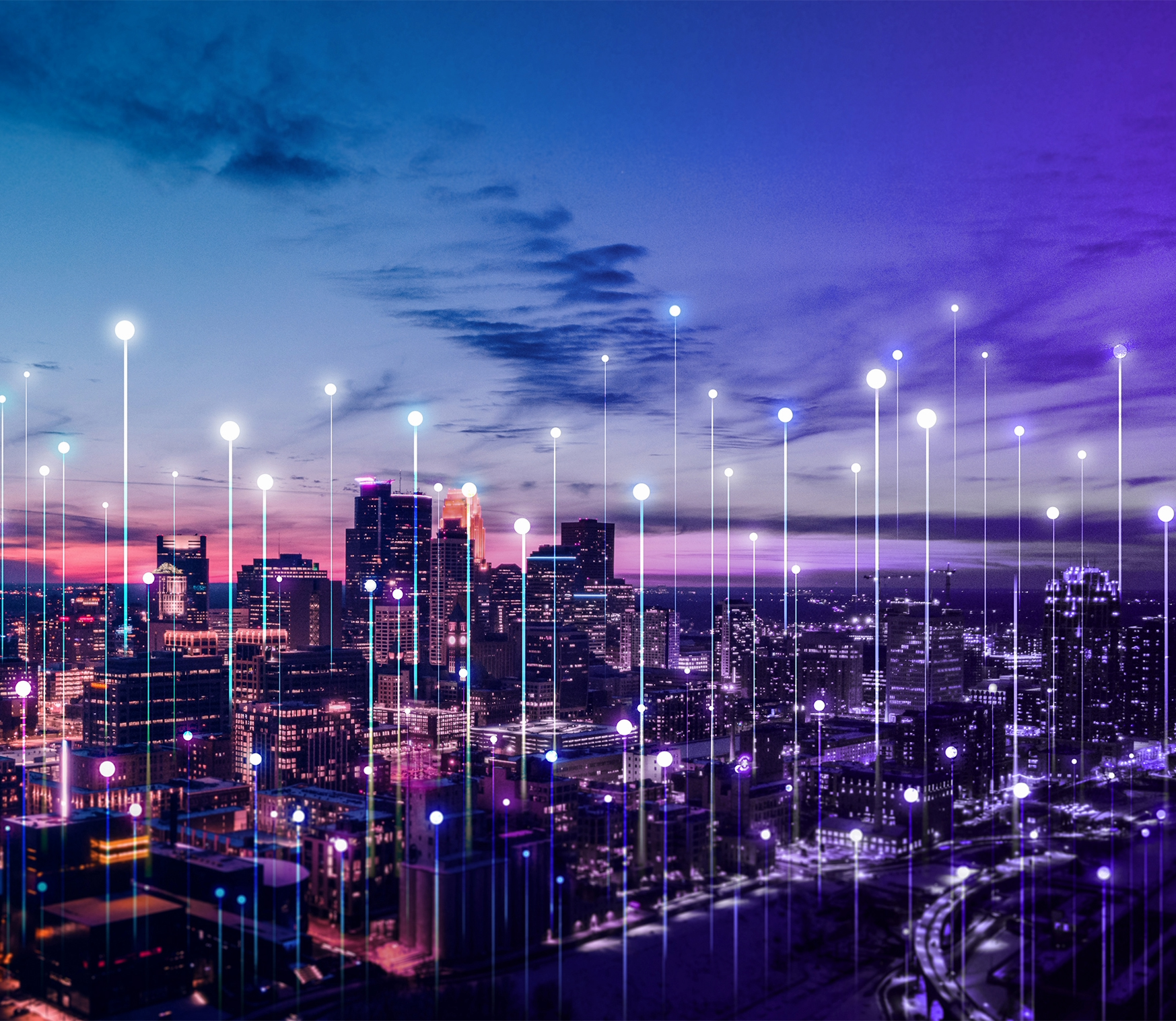 City skyline at dusk with digital technology overlay showing data points and connectivity lines.