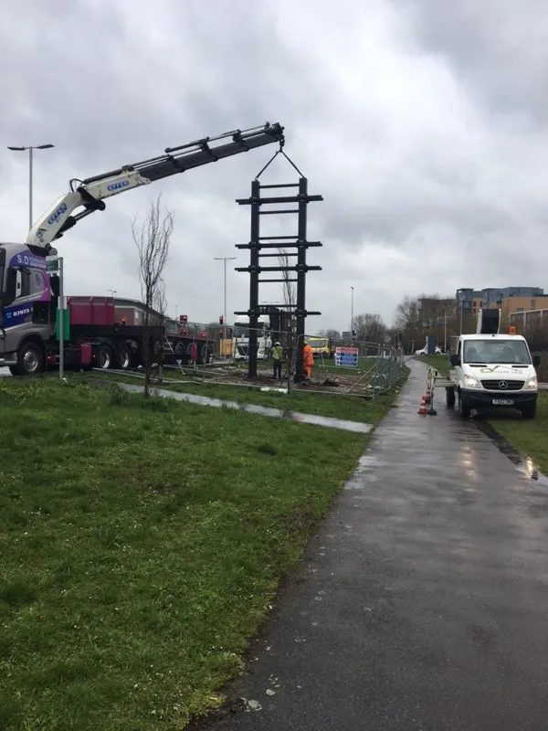 Crane truck installing a new digital screen structure, demonstrating DOOHable's development expertise from groundworks to completion