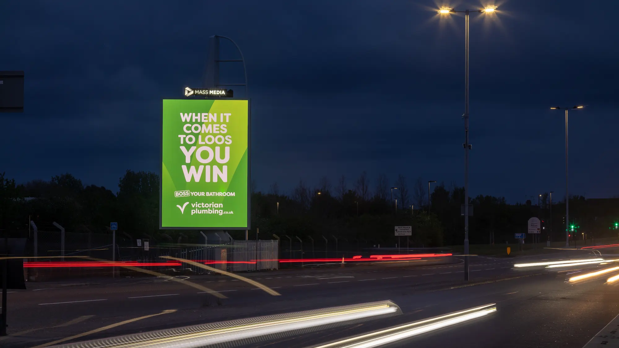 Premium roadside digital billboard network asset glowing at dusk, representing the scale of media owner operations DOOHable supports