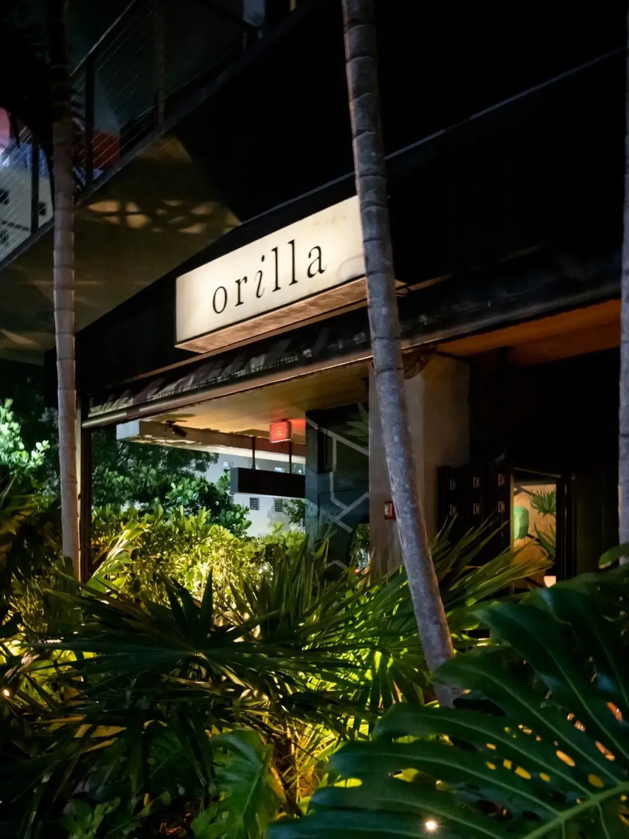 Lighted signage of the Orilla bar