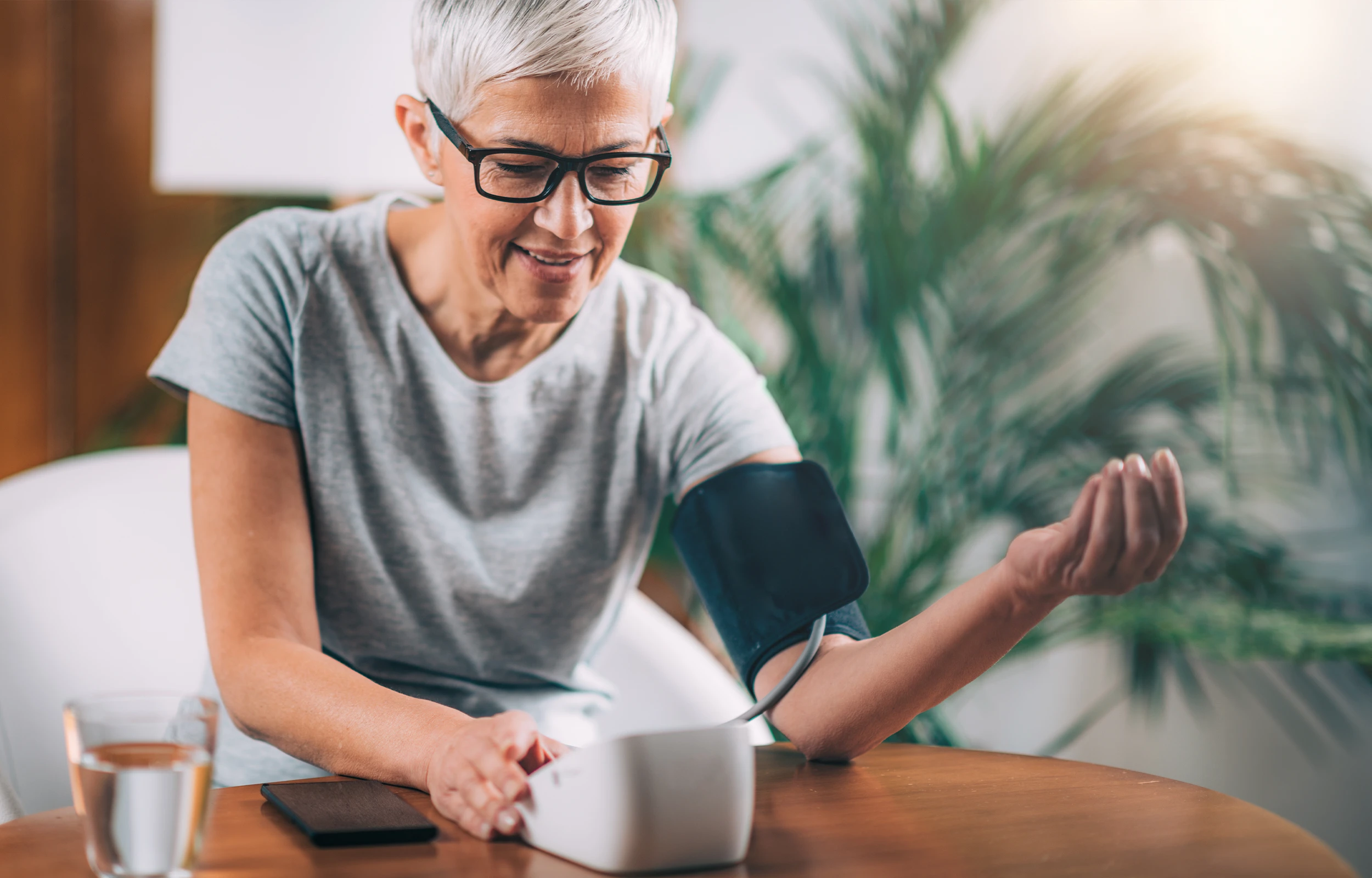 A woman checking her blood pressure