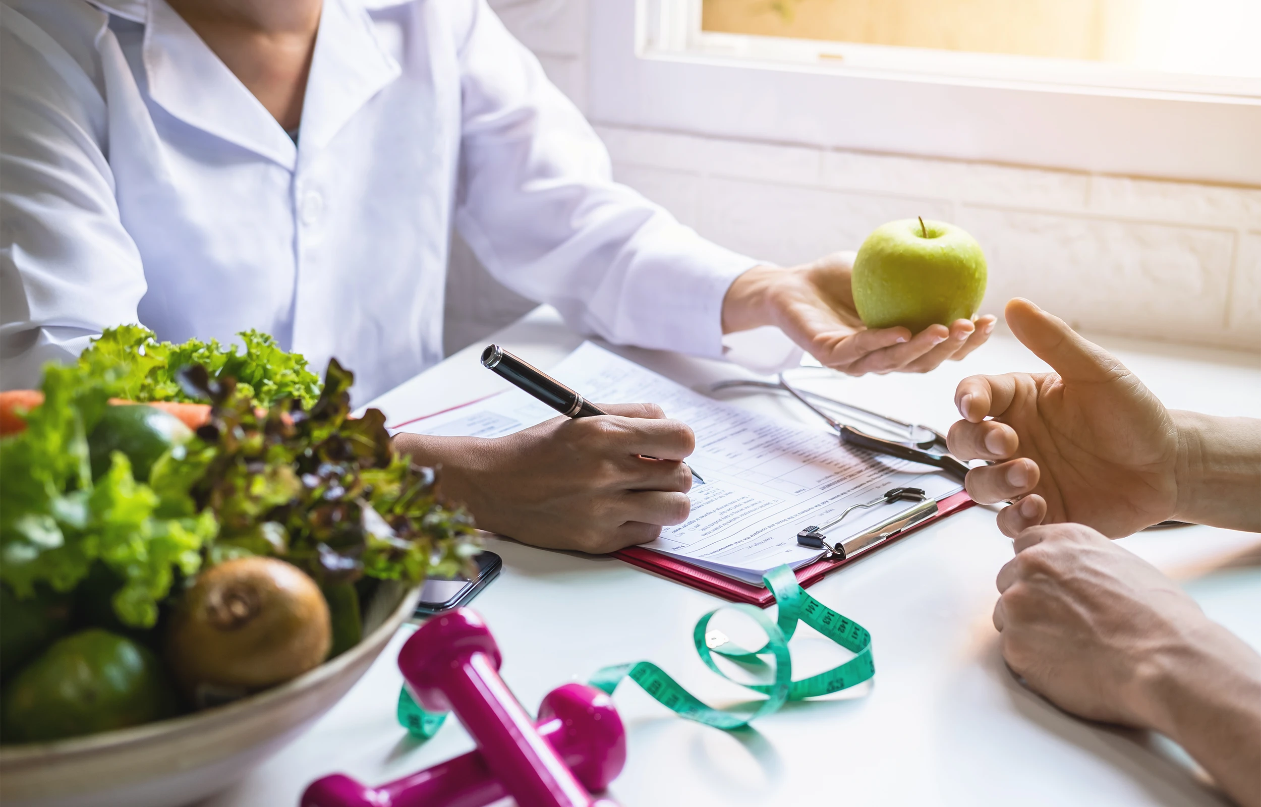 A doctor talking to a patient about physician assisted weight loss