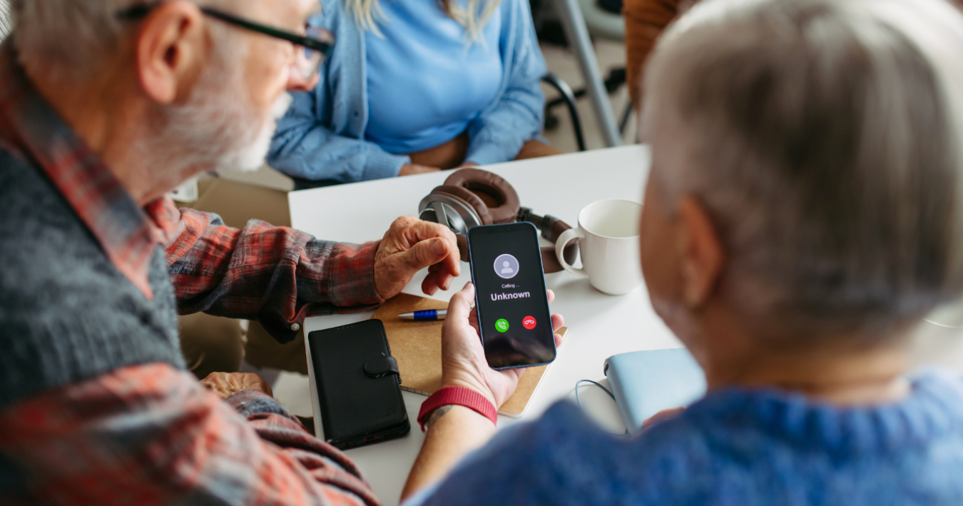 iphone and android phones showing 'scam likely' and 'suspected scam' warnings on phonecalls