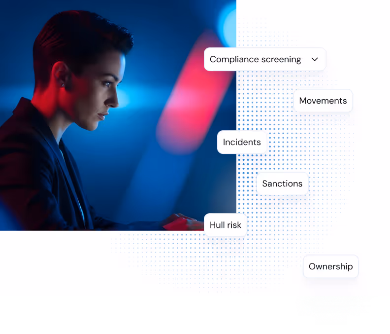 Woman in blue and red light focusing on screen with compliance screening terms displayed.