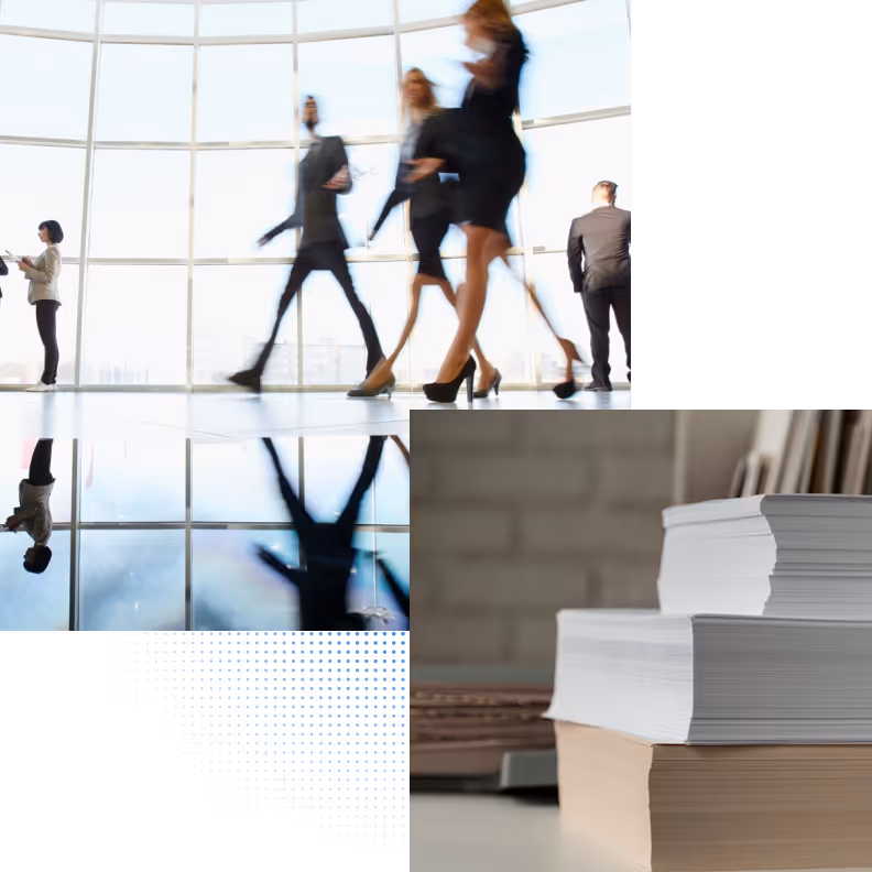 Blurred business people walking in a modern office with large windows and stack of books nearby.