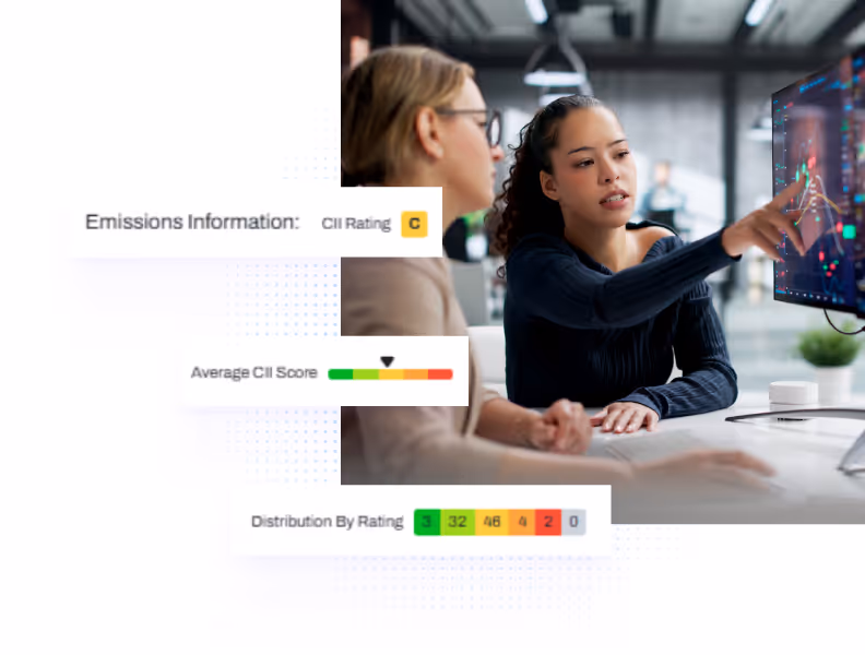 Two women analyzing data on a screen showing emissions CII rating, average score, and rating distribution.